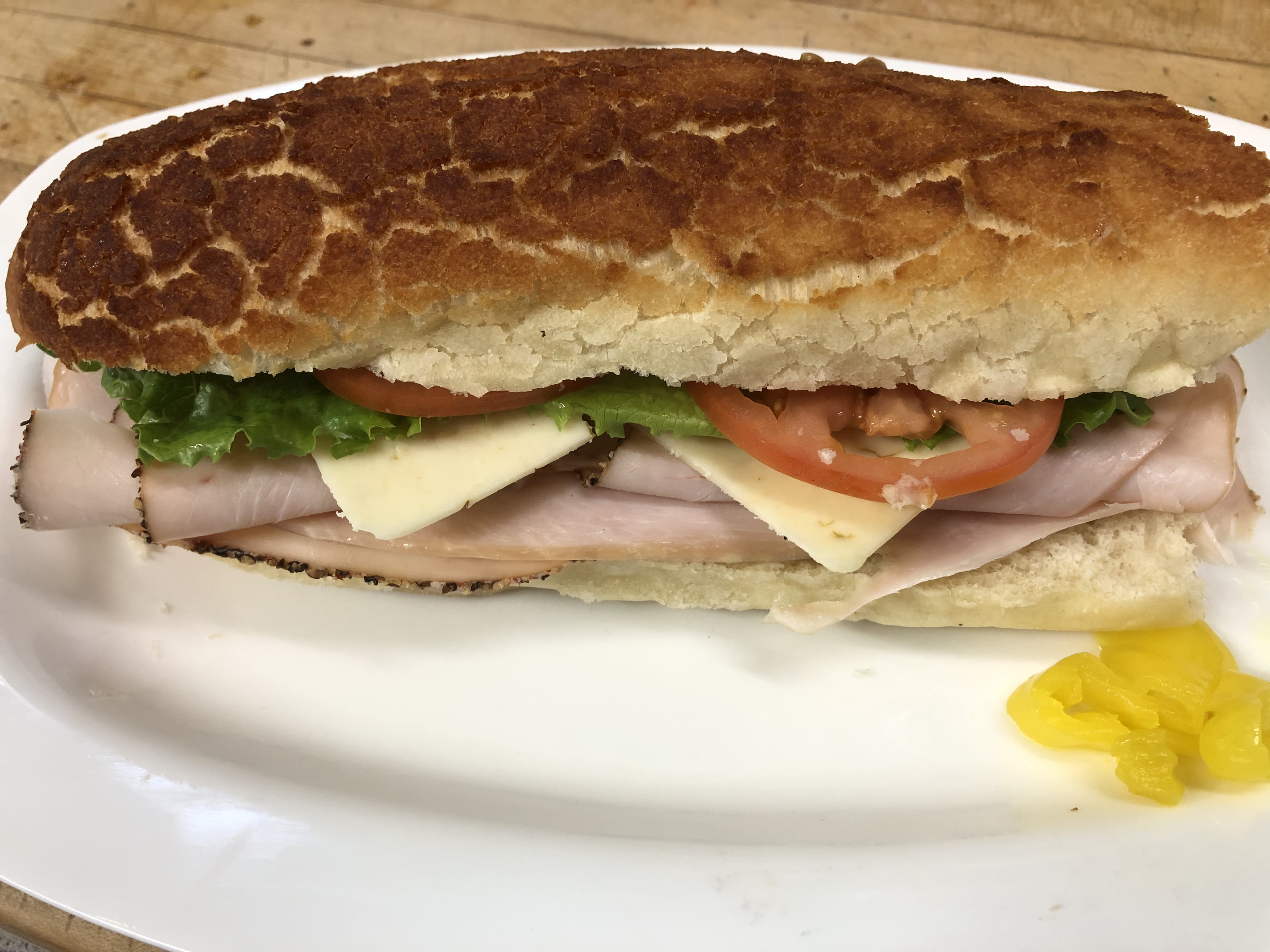 Order Cracked Pepper Turkey Sandwich food online from Lucca Food Deli store, San Francisco on bringmethat.com
