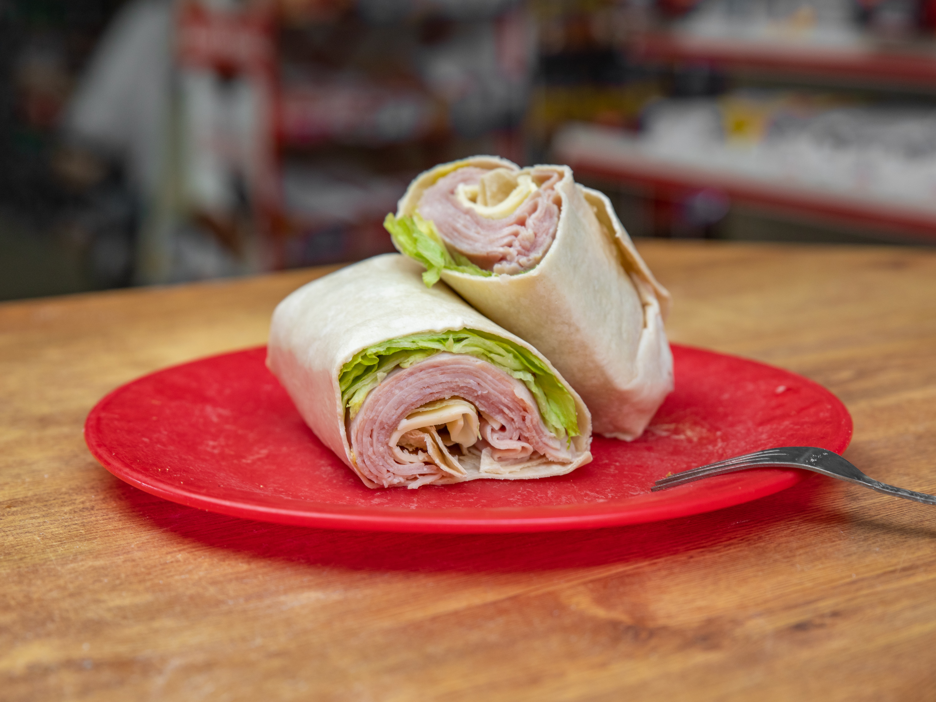 Order Deluxe Ham and Cheese Wrap food online from Krauszers Food Store store, Branford on bringmethat.com