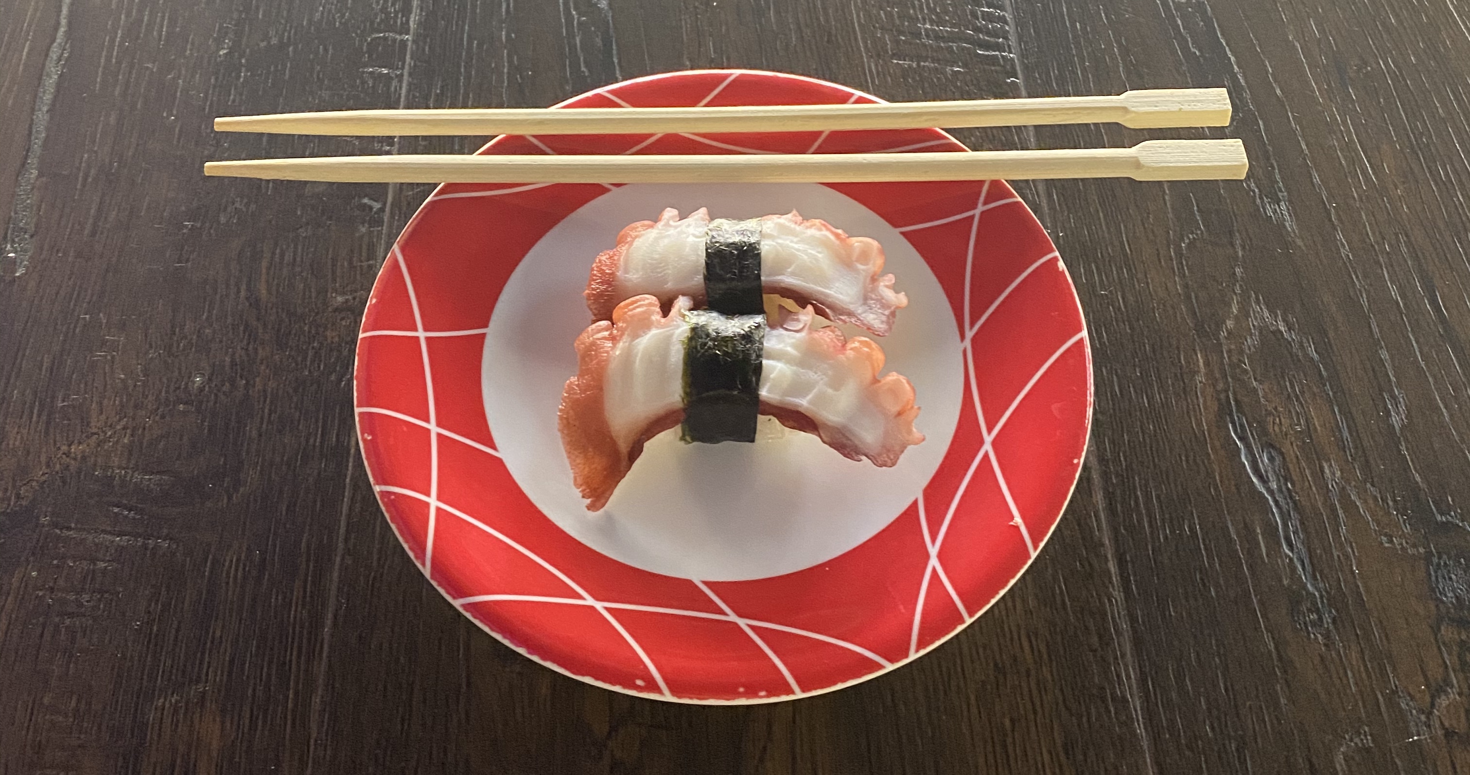 Order Tako Nigiri - 2 Pieces food online from Sushi Train store, Minneapolis on bringmethat.com