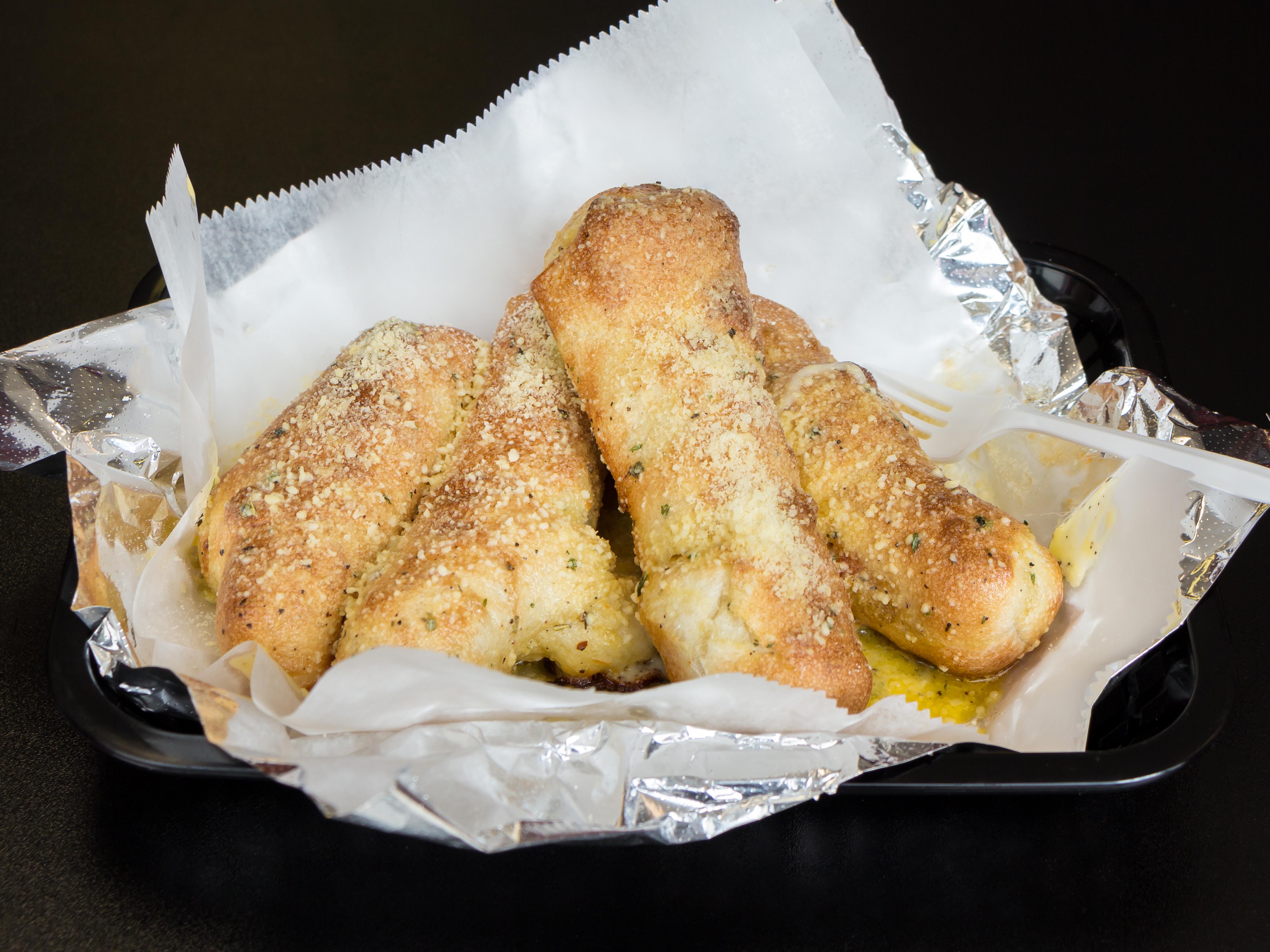 Order 4 Pepperoni Rolls food online from Gumby's Pizza store, Raleigh on bringmethat.com