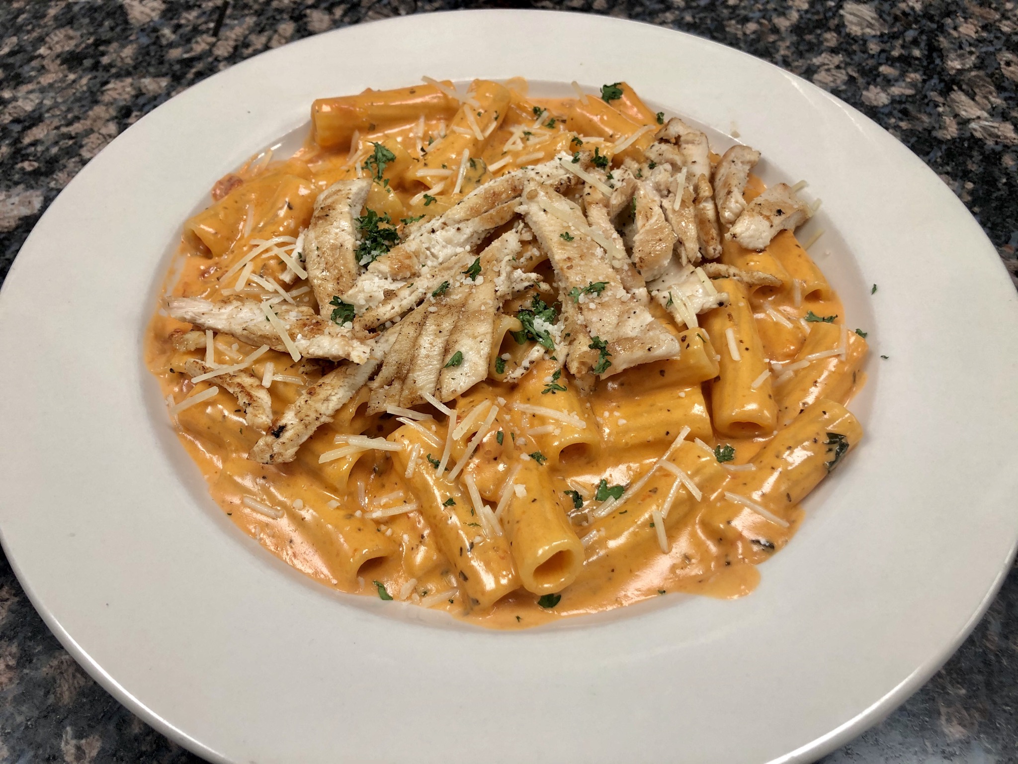Order Vodka Rigatoni with Grilled Chicken Specialty food online from Vinny Italian Grill store, Fredericksburg on bringmethat.com