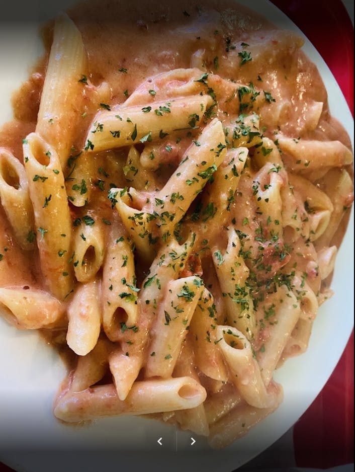 Order Penne A La Vodka - Pasta food online from Pizza Mania store, Norcross on bringmethat.com