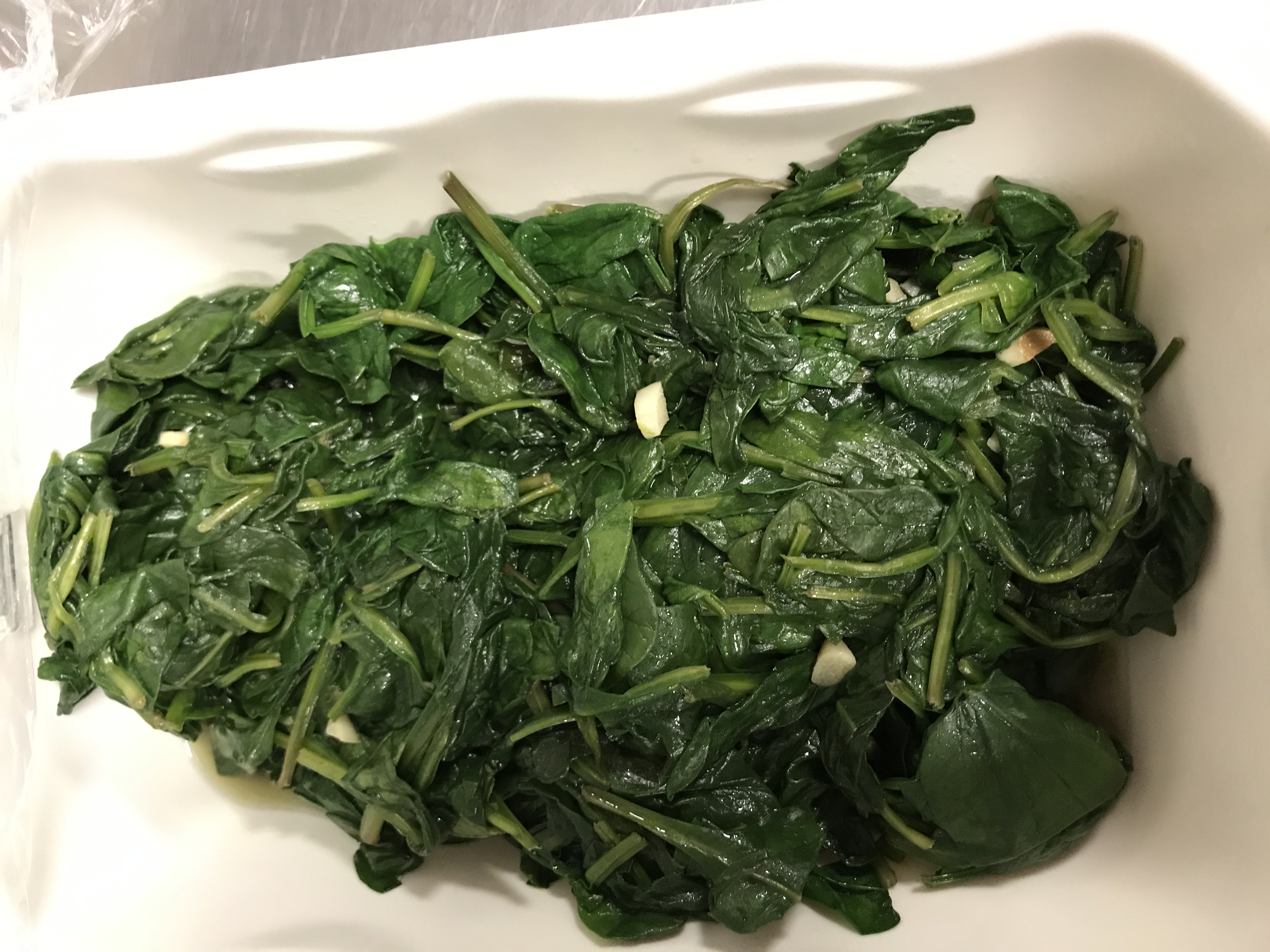 Order 1/2 lb. Sauteed Spinach food online from CreekSide Co-op store, Elkins Park on bringmethat.com