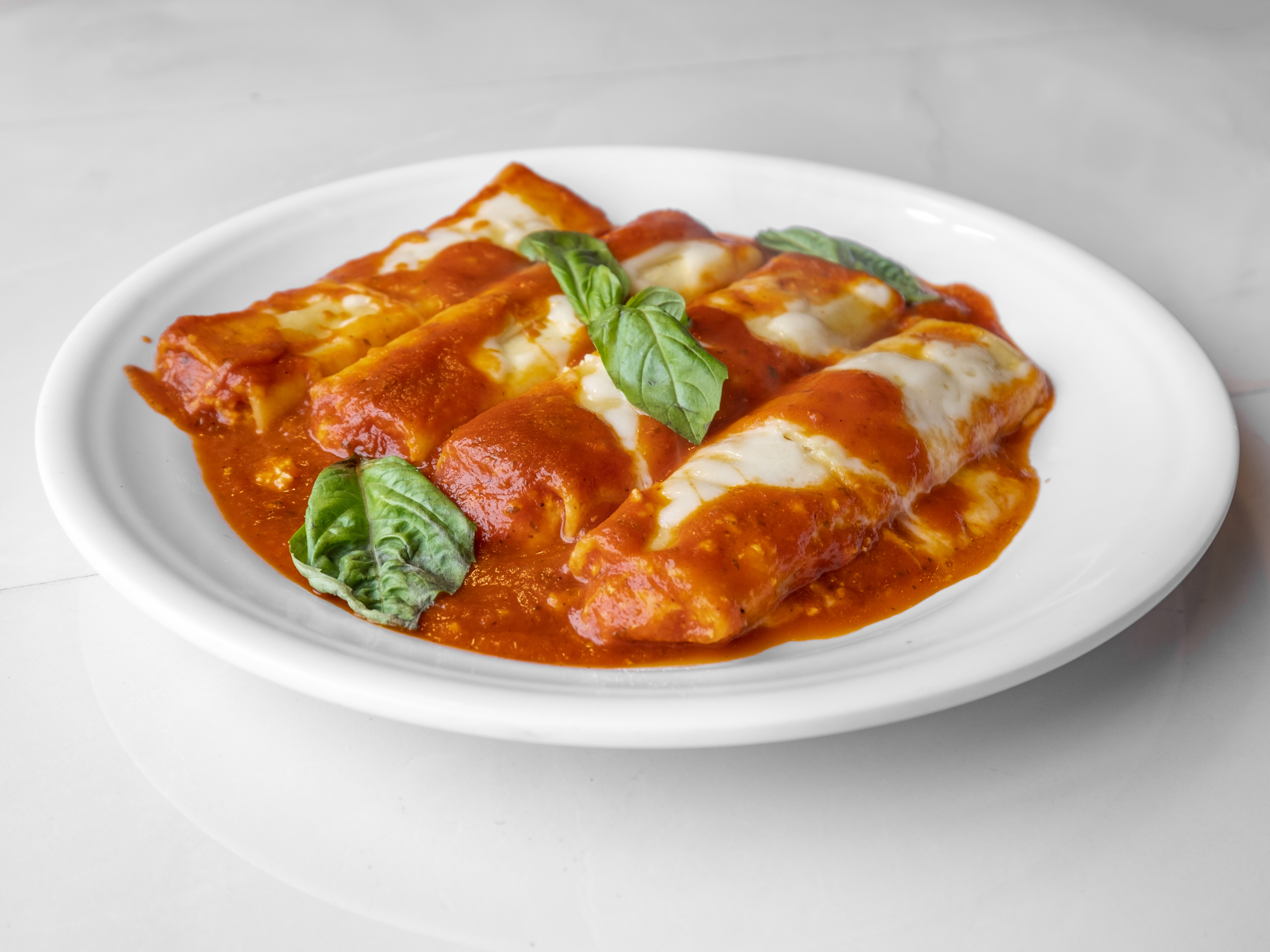 Order Manicotti food online from New Yorker Pizza store, Leesburg on bringmethat.com