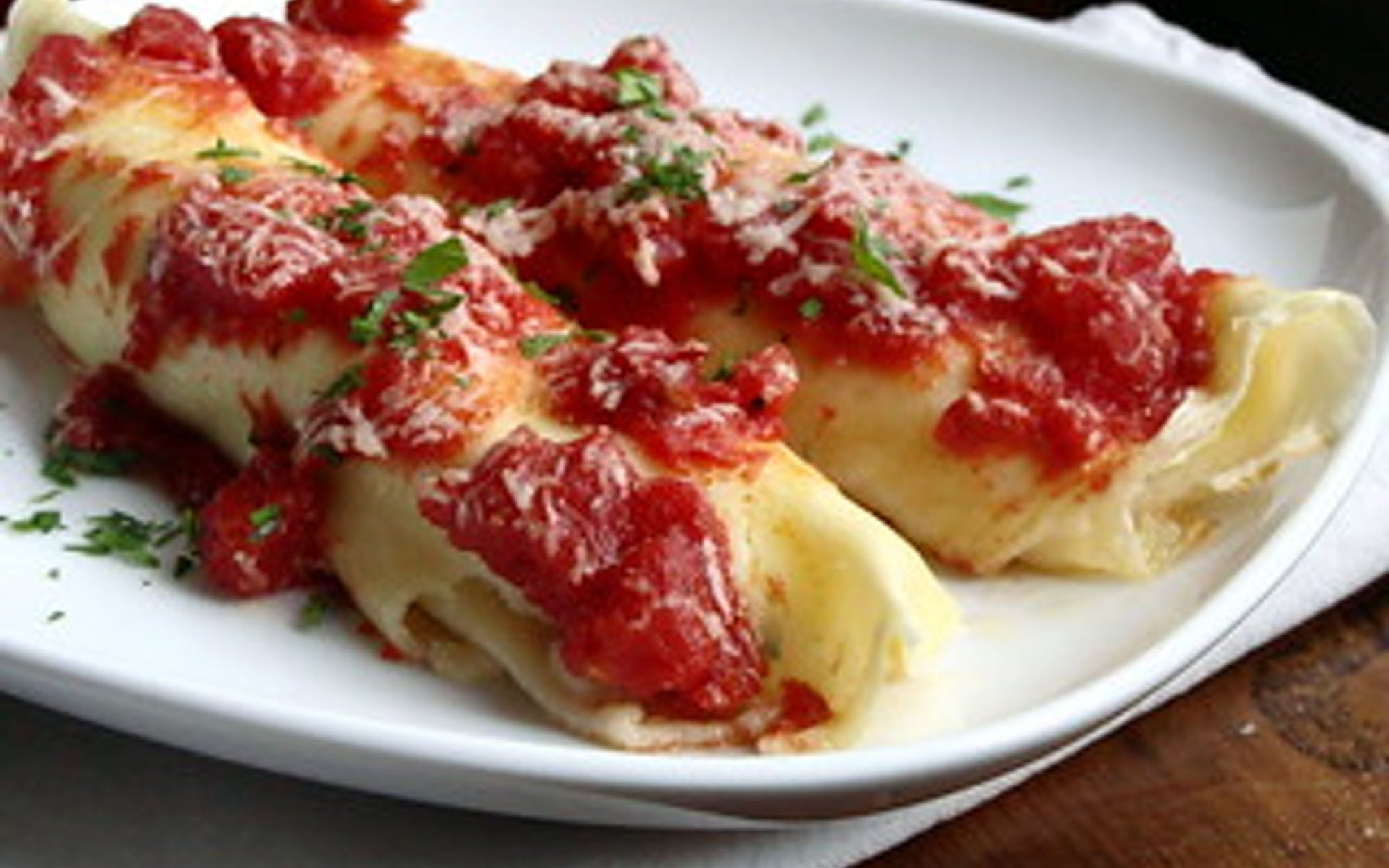 Order Manicotti - Pasta food online from Pino's Pizzeria store, Easton on bringmethat.com
