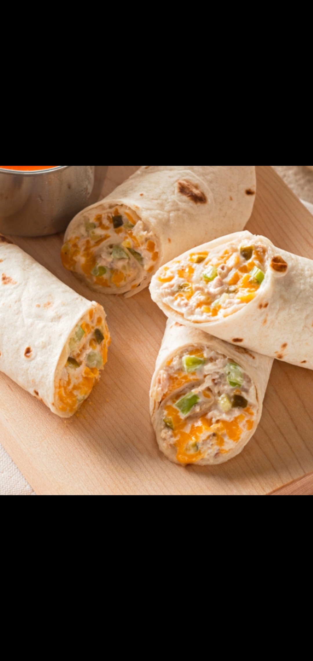 Order Classic Tuna & Cheddar Melt Wrap (tuna Vermont cheddar lettuce & tomatoes) food online from American Gourmet Foods Deli store, New York on bringmethat.com