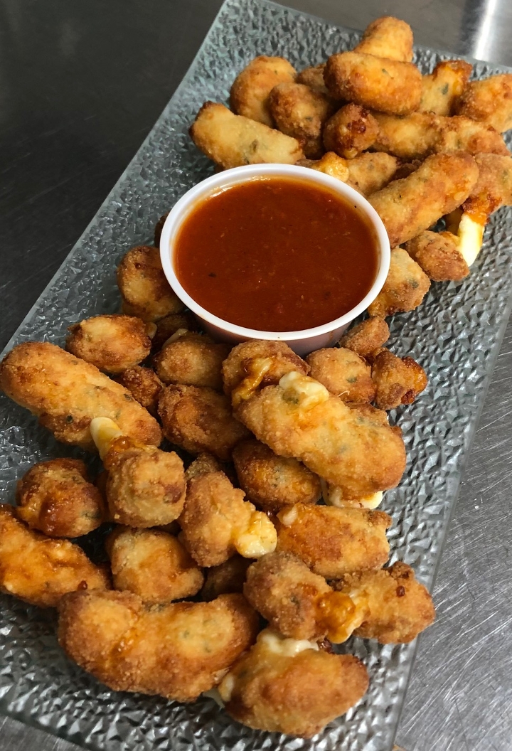 Order Crispy Garlic Cheese Curds_ food online from The Grapevine Restaurant & Catering store, Buffalo on bringmethat.com