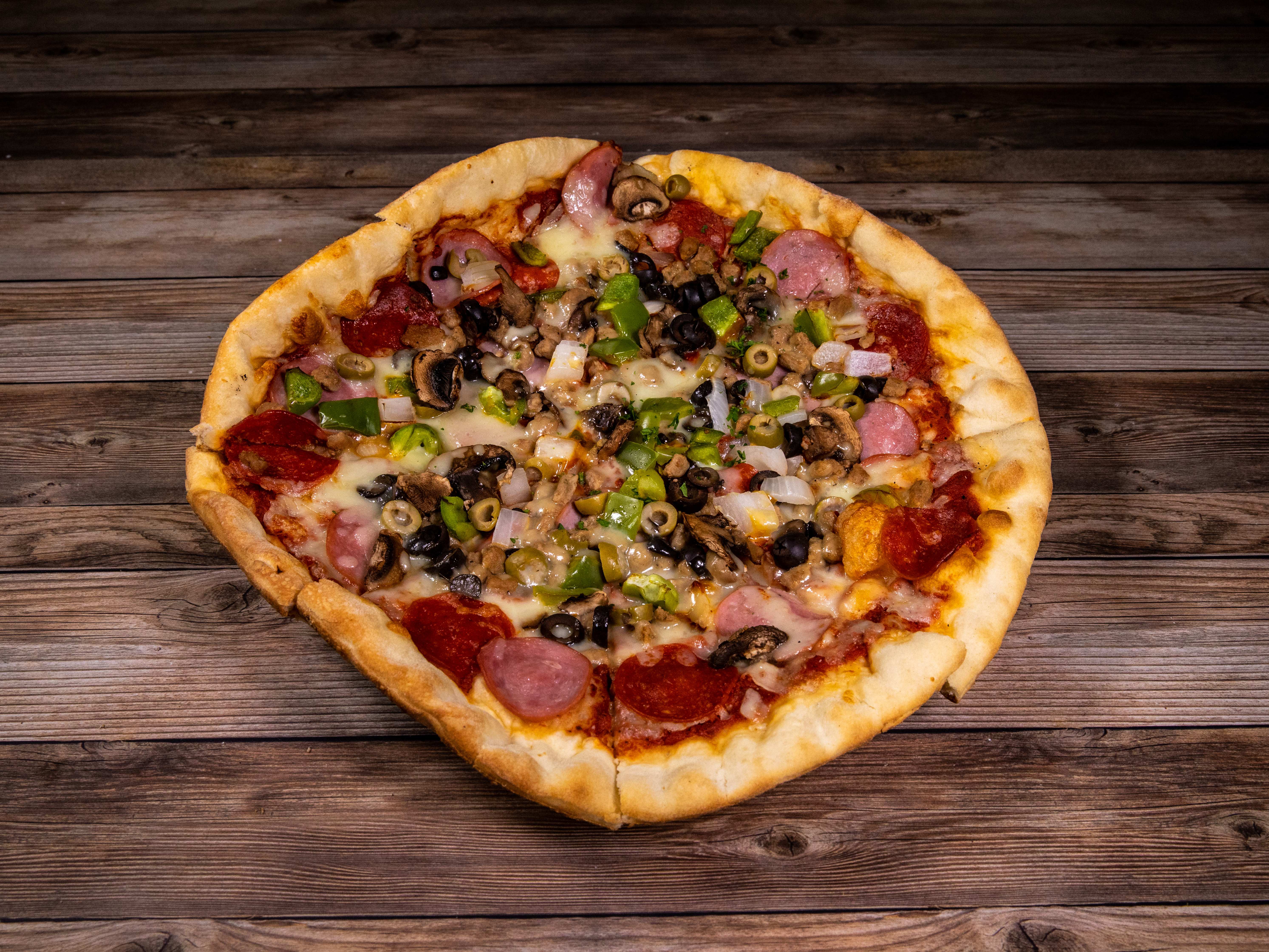 Order Spectacular 9 Toppings Pizza food online from Eddie Napolis store, Garland on bringmethat.com