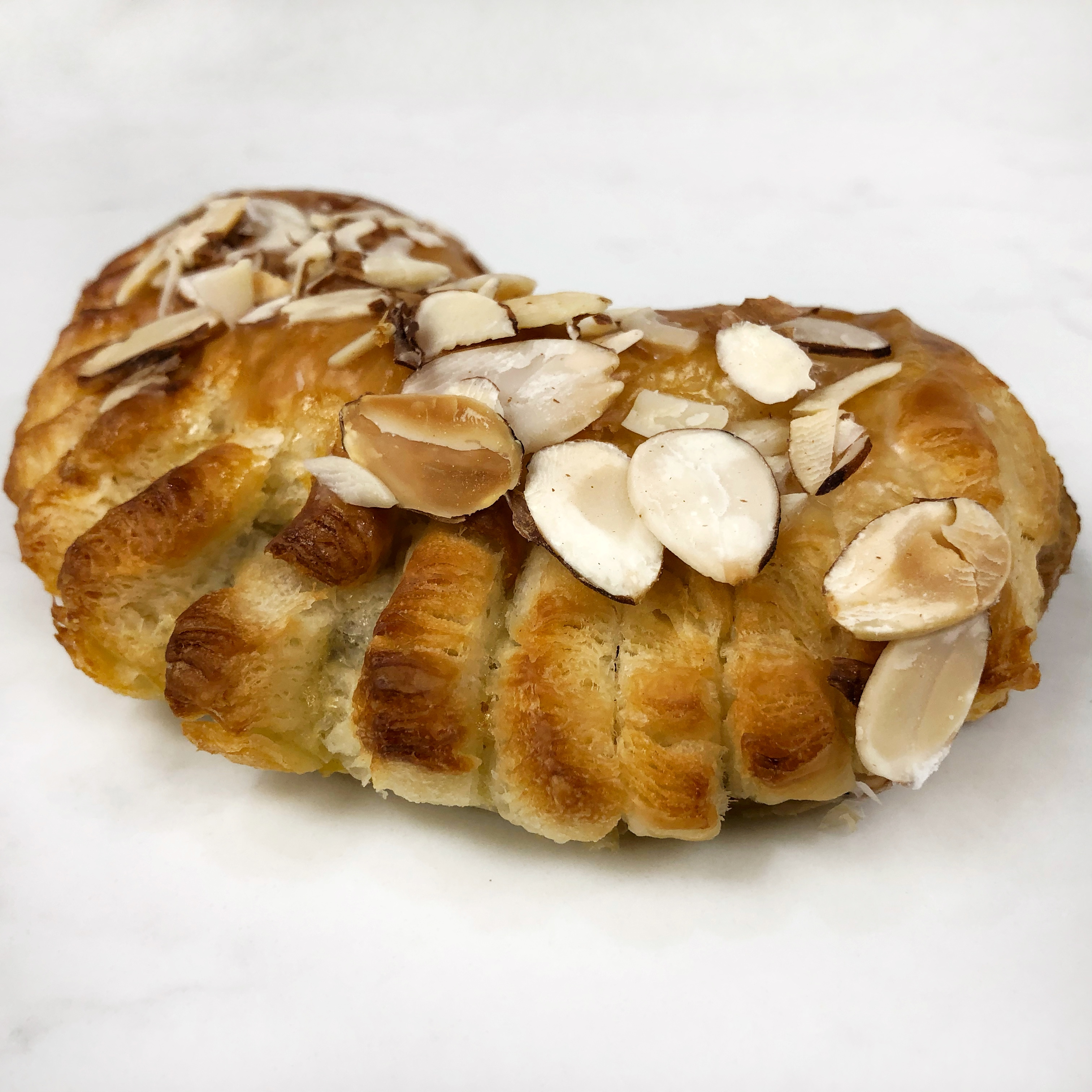 Order Almond Bear Claw Croissant food online from The Donuttery store, Huntington Beach on bringmethat.com