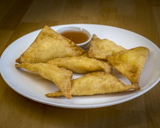 Order 6. Crabmeat Rangoons with Cream Cheese food online from Chan's Peking store, Poughkeepsie on bringmethat.com