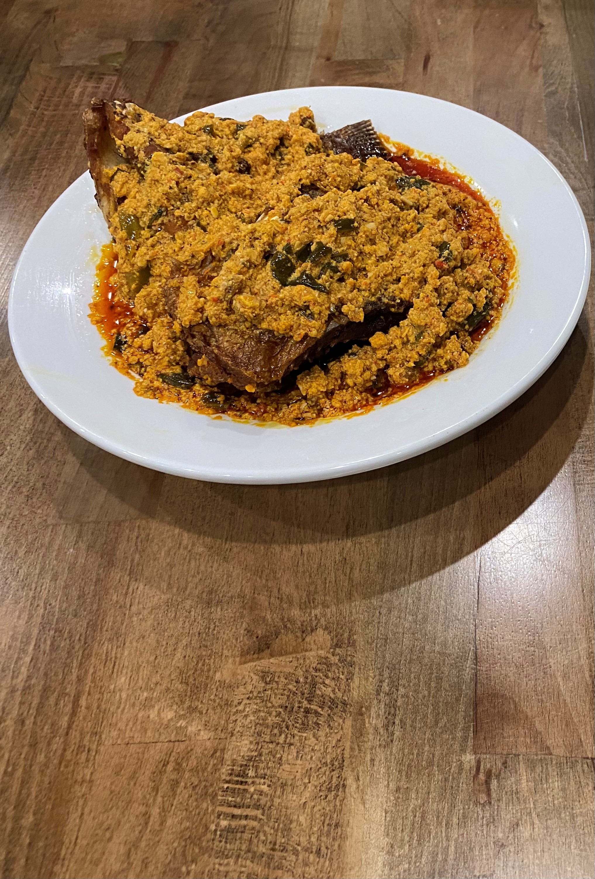 Order Egusi Soup + Fish food online from Fusion Vibes Kitchen + Bar store, Richardson on bringmethat.com