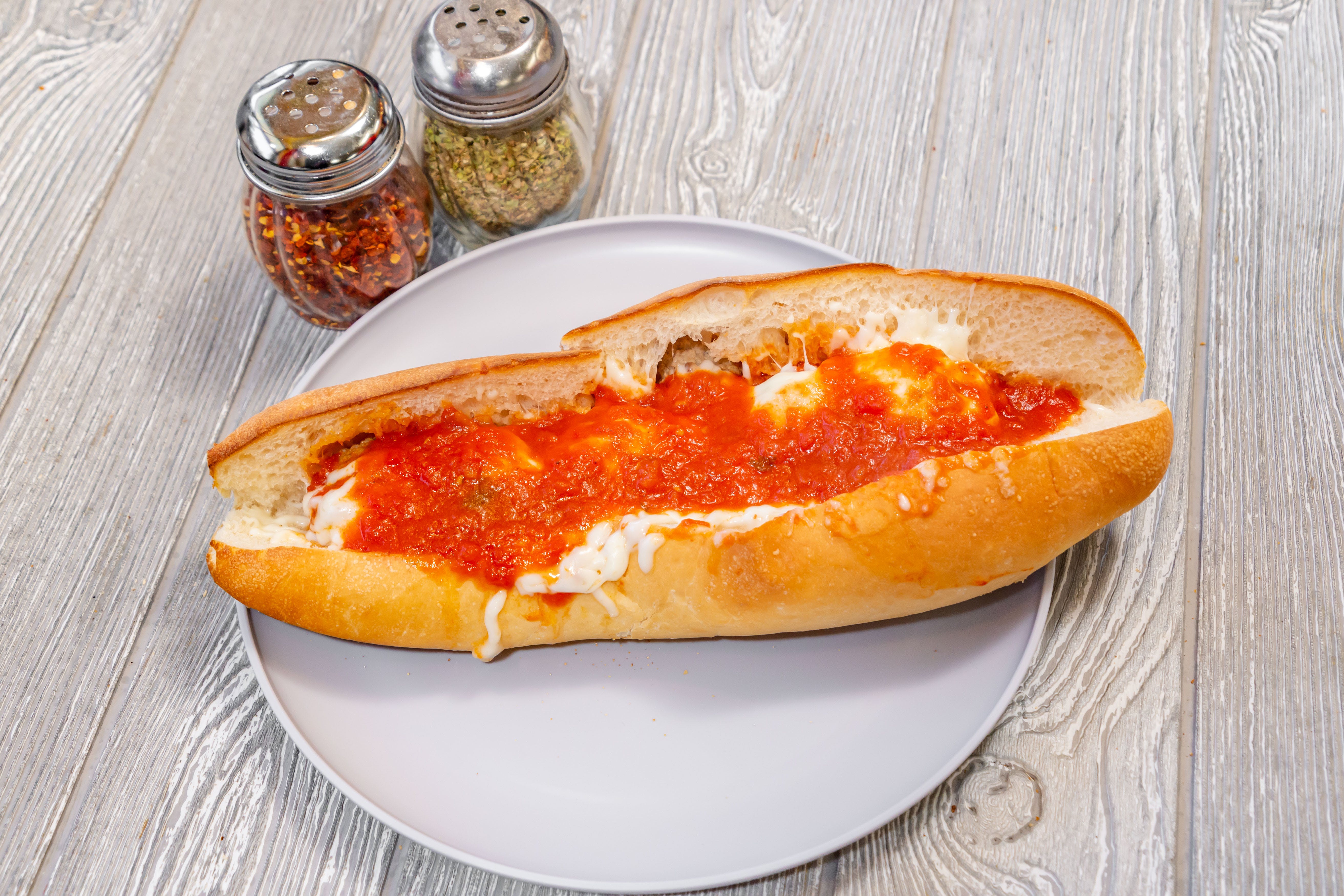 Order Meatball Parmigiana Sub - Small 9" food online from Gianni Pizza store, Wilmington on bringmethat.com