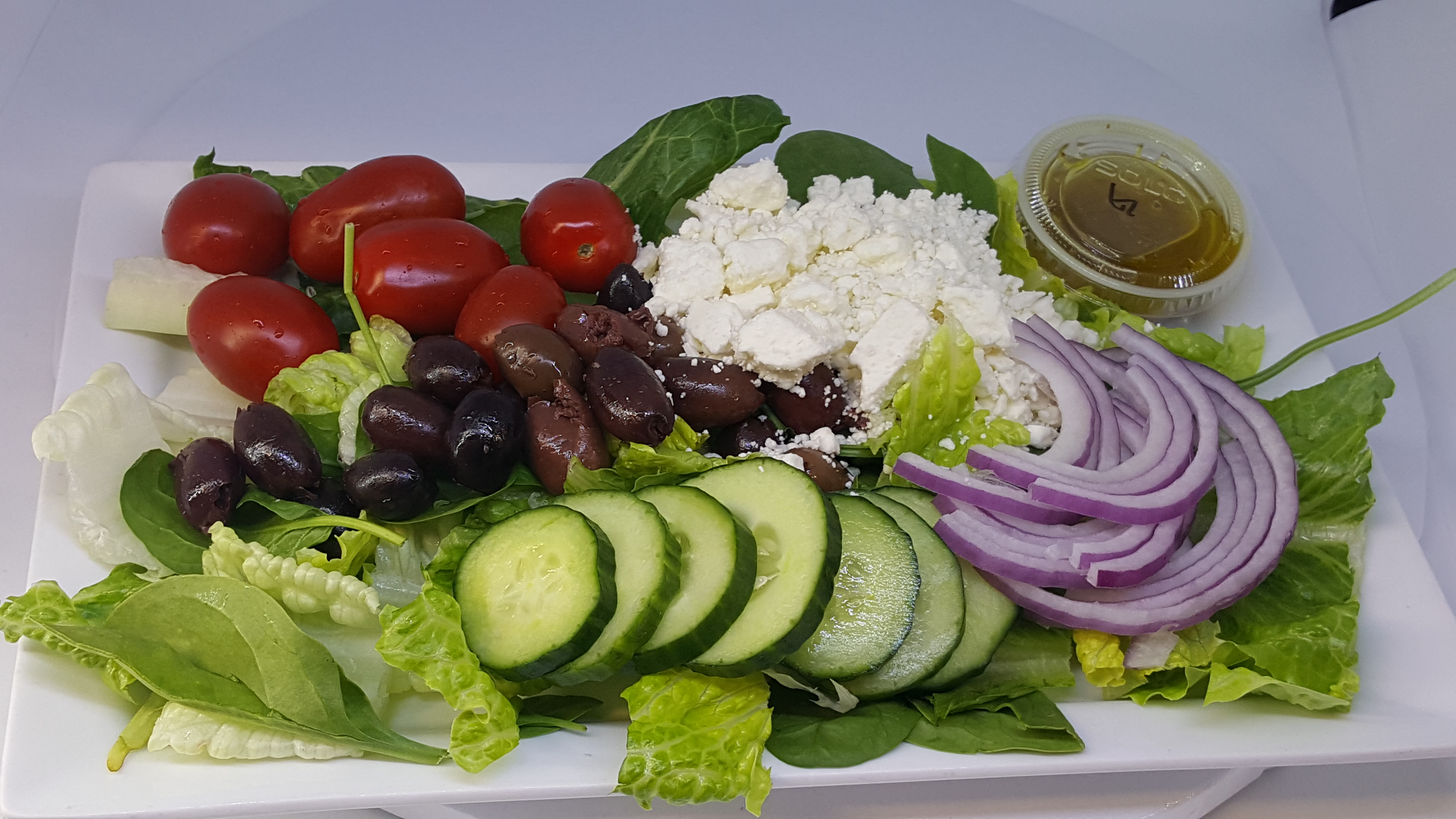 Order Greek Salad food online from La Bakery store, Carson City on bringmethat.com