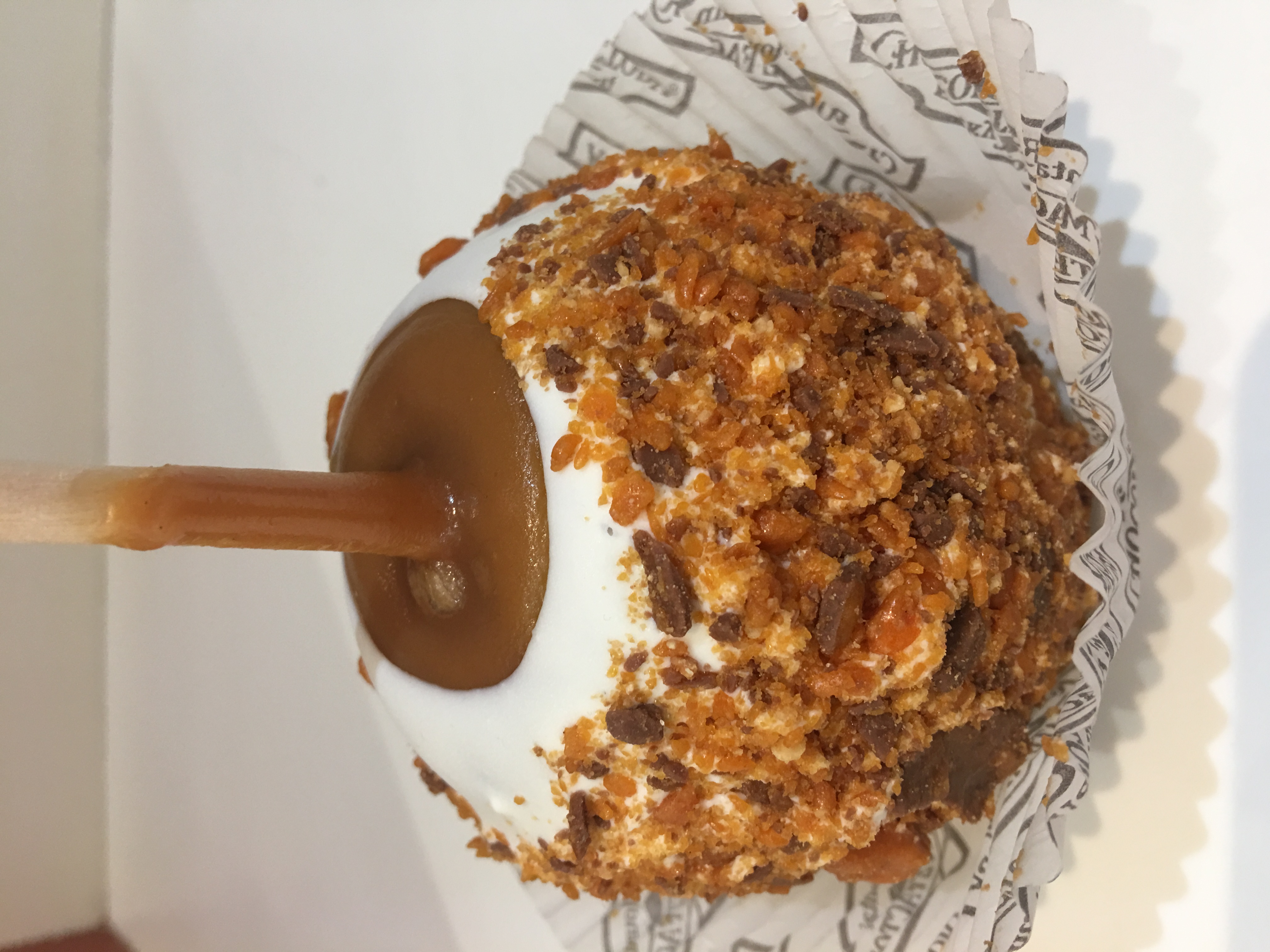 Order Butterfinger Caramel Apple food online from Rocky Mountain Chocolate Factory store, Redondo Beach on bringmethat.com