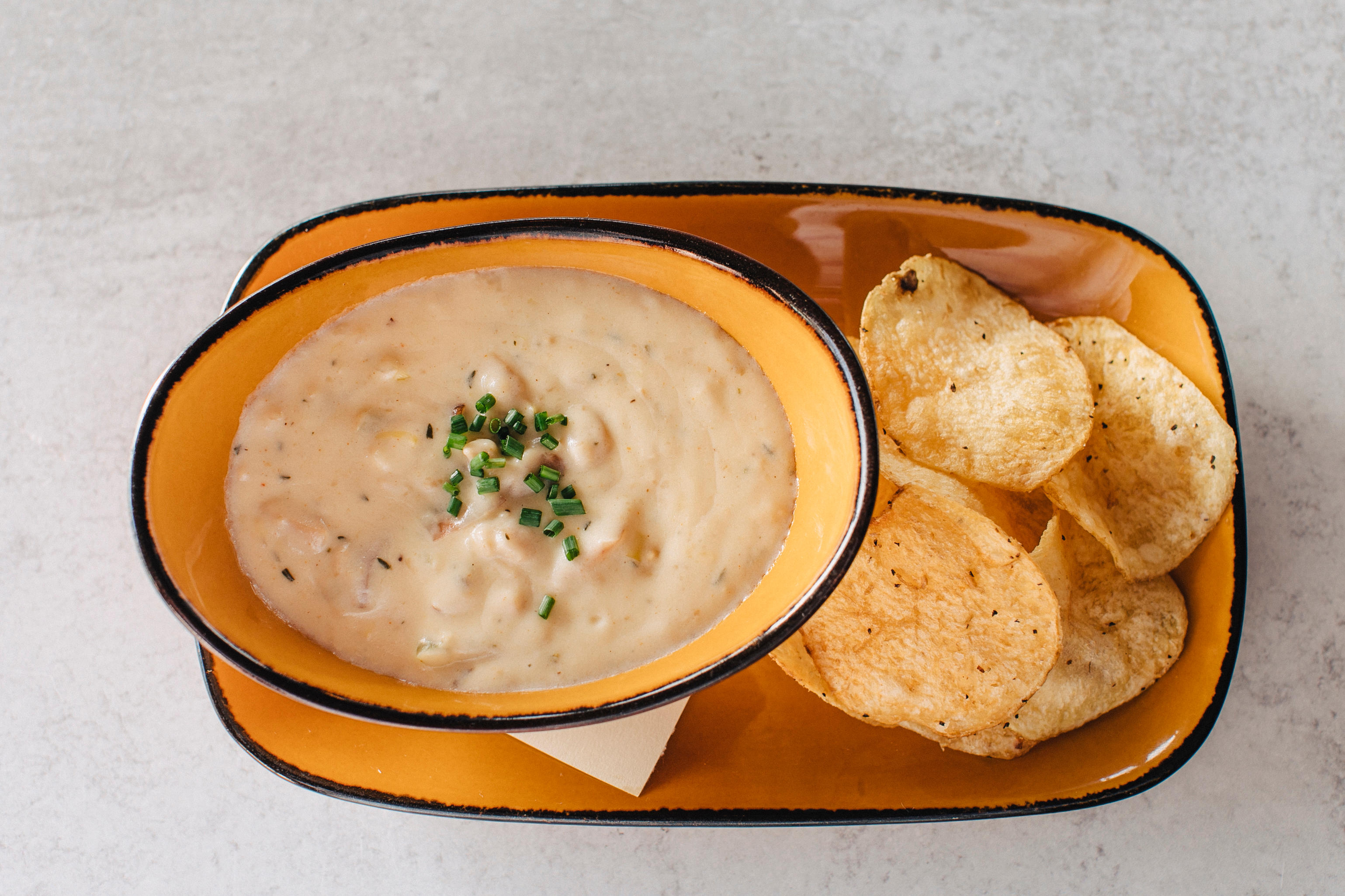 Order New England Style Clam Chowder food online from Jimmy Famous American Tavern store, San Diego on bringmethat.com