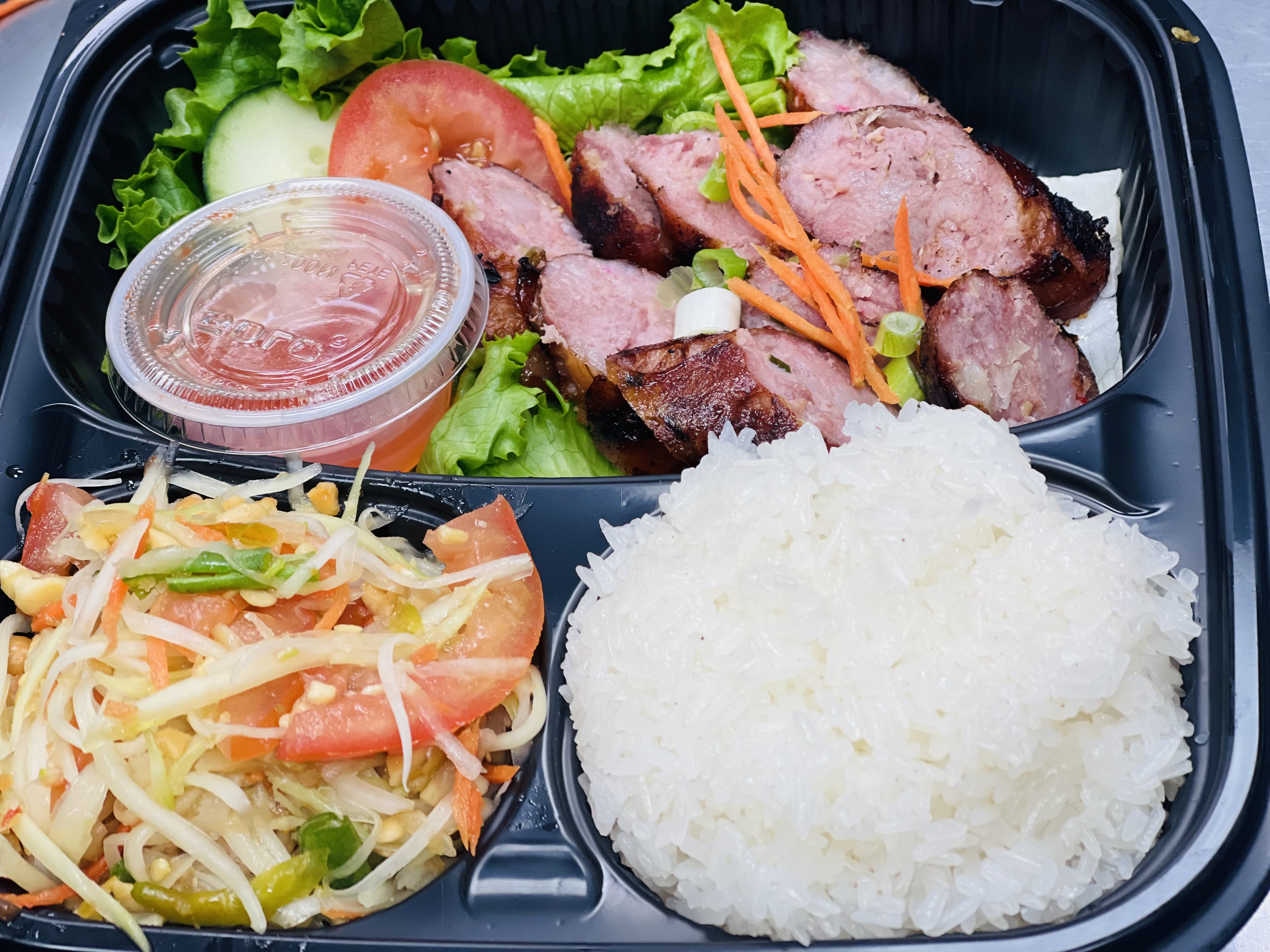 Order Laos Sausages 2 Pieces With Sticky Rice & Thai Papaya Salad Style food online from Thai Aroy Dee store, Drexel Hill on bringmethat.com