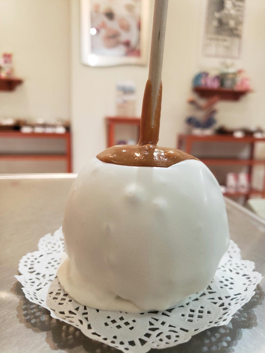 Order Caramel Apple with White Confection food online from Rocky Mountain Chocolate Factory store, Winston-Salem on bringmethat.com