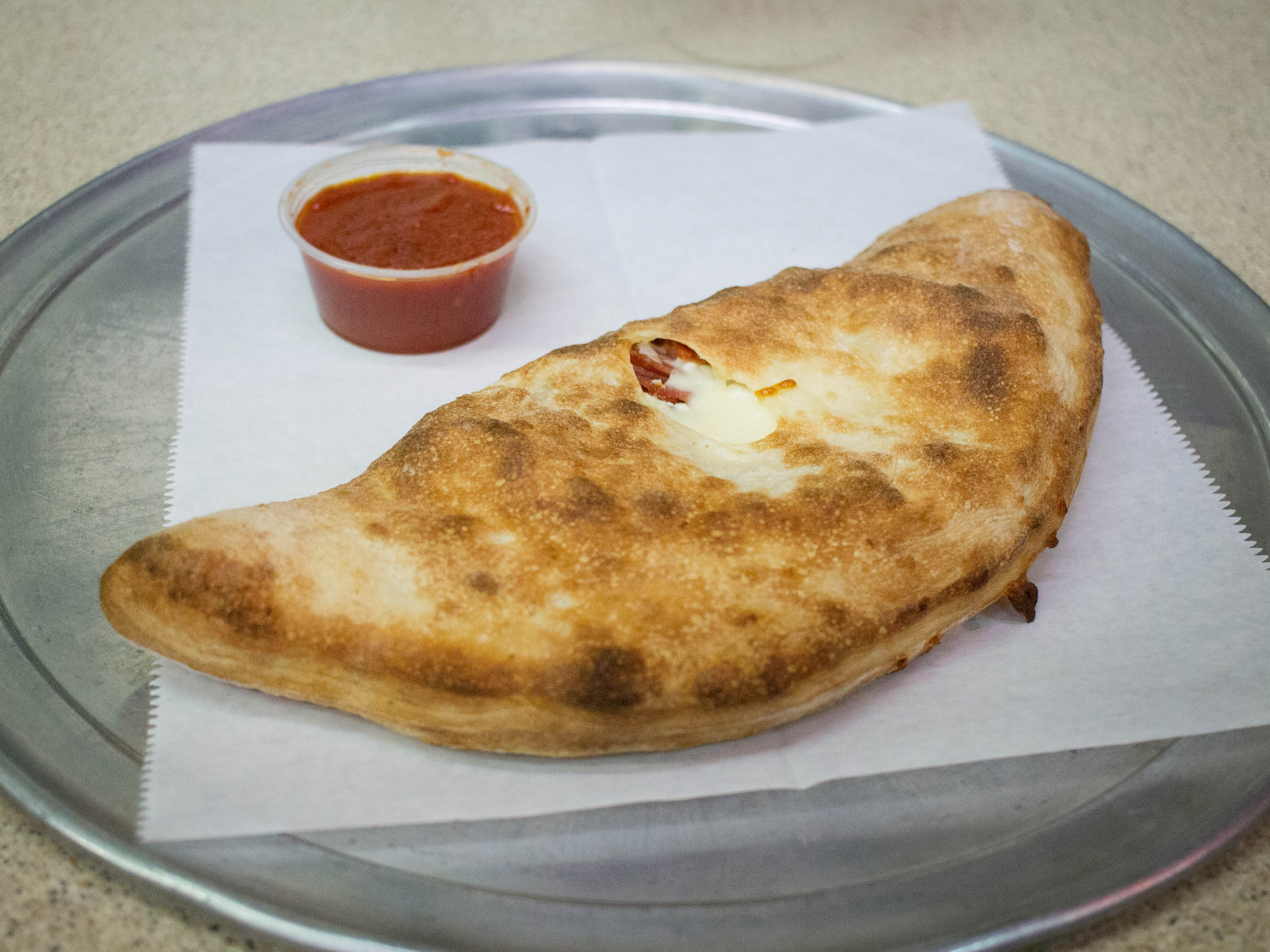Order Cheese Calzone food online from Milano's Pizza store, Allison Park on bringmethat.com