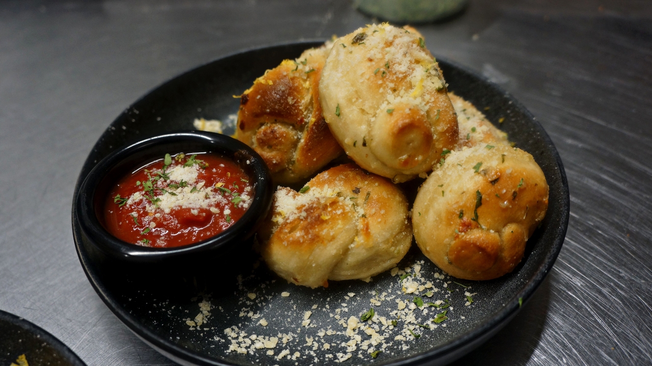 Order GARLIC KNOTS food online from Groundswell The Palate store, Chula Vista on bringmethat.com