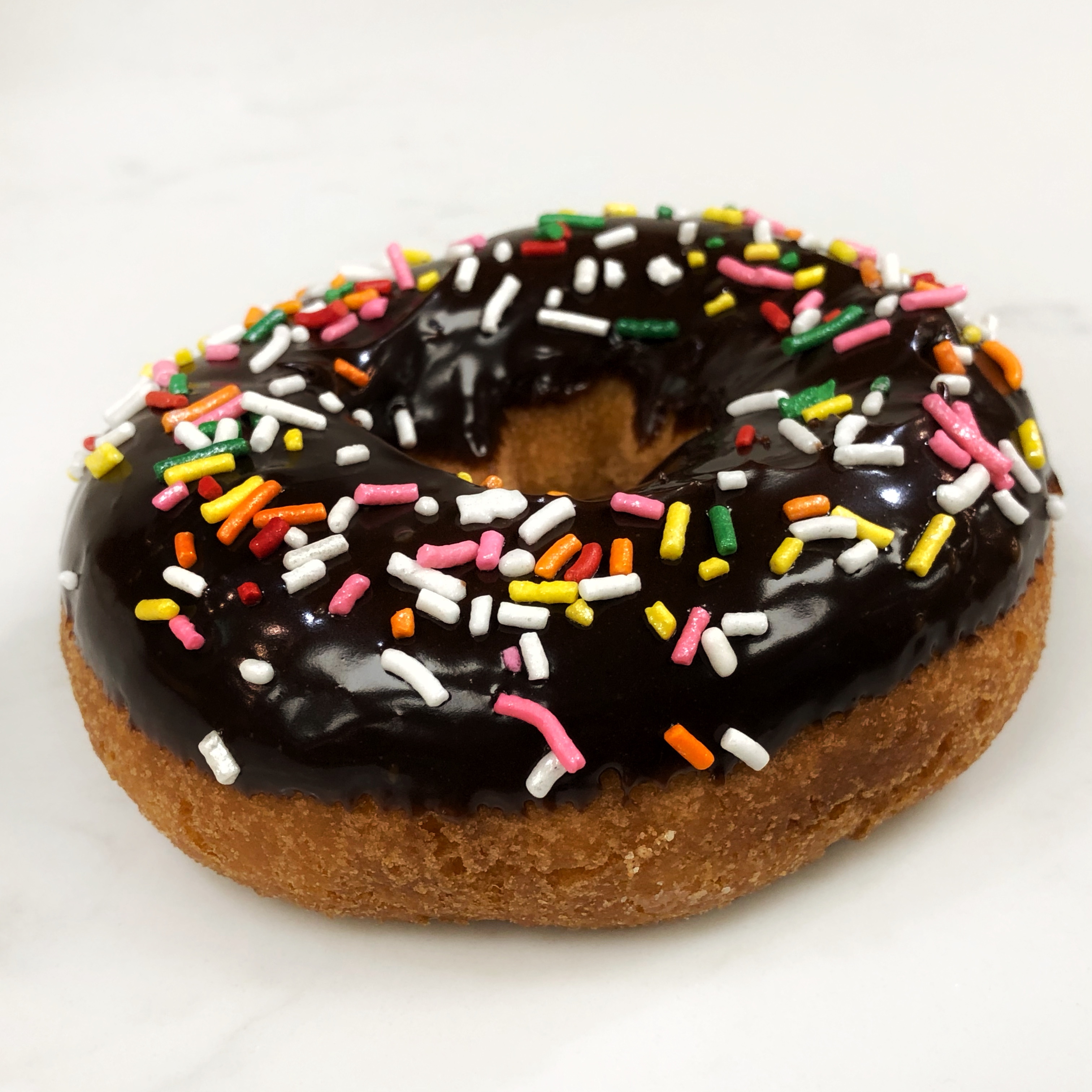 Order Sprinkles Cake food online from The Donuttery store, Huntington Beach on bringmethat.com