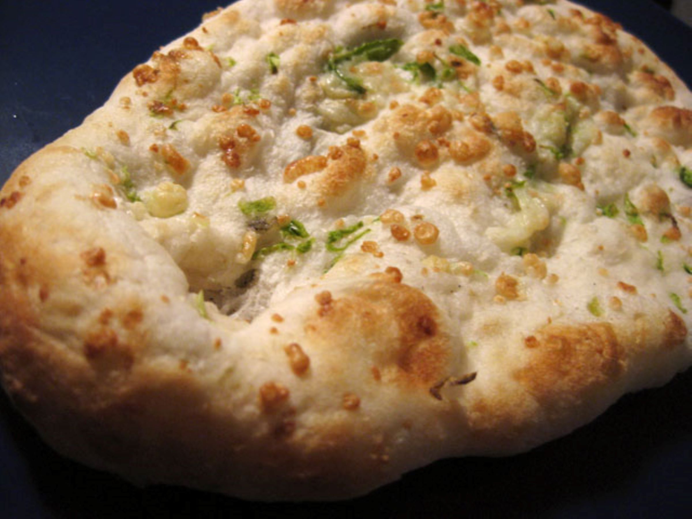 Order Cheese Garlic Naan food online from The indian kitchen store, West Hollywood on bringmethat.com