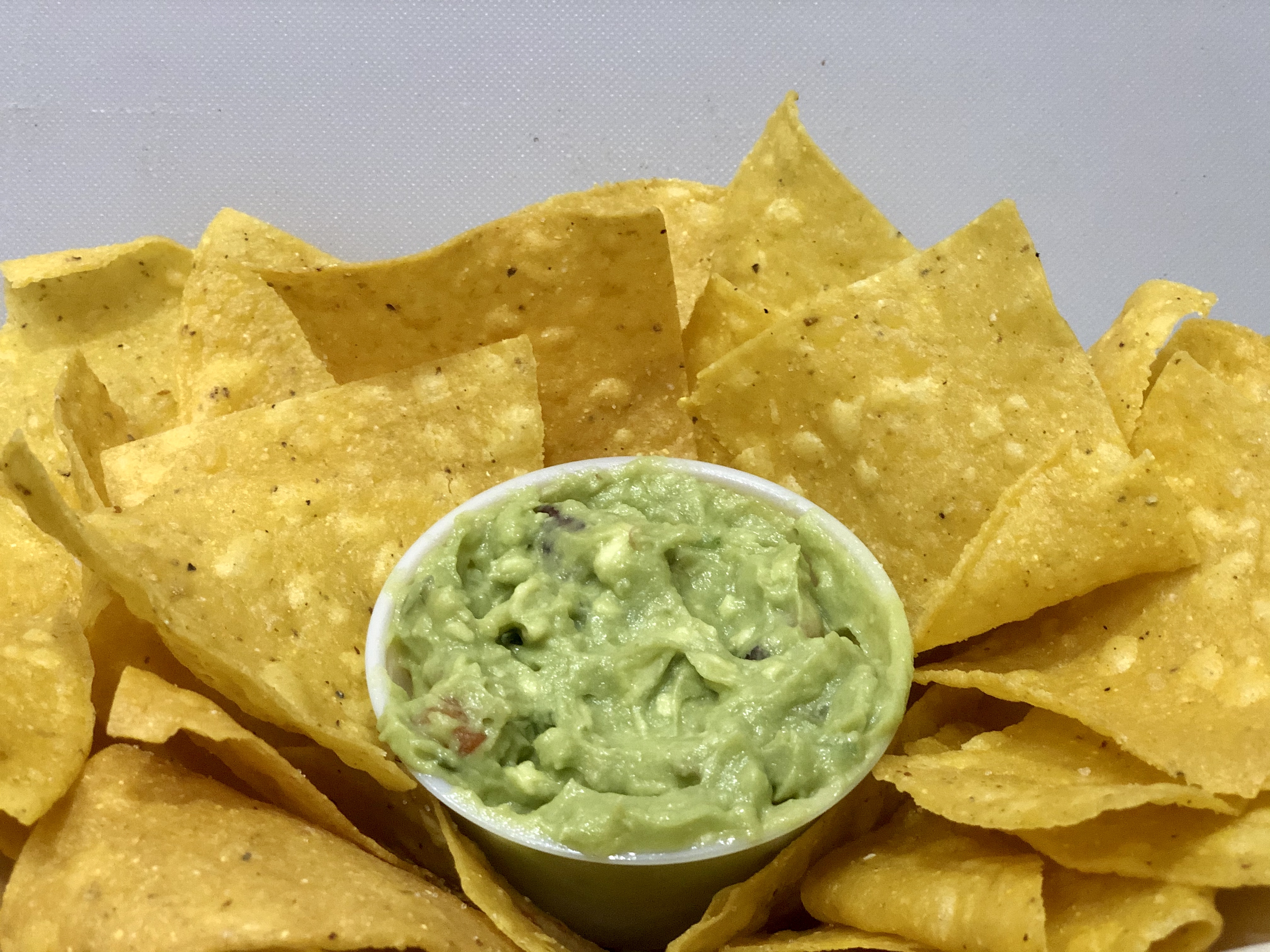 Order LARGE (8 oz) - Guacamole & House Made Chips food online from El barrio burritos store, Brooklyn on bringmethat.com