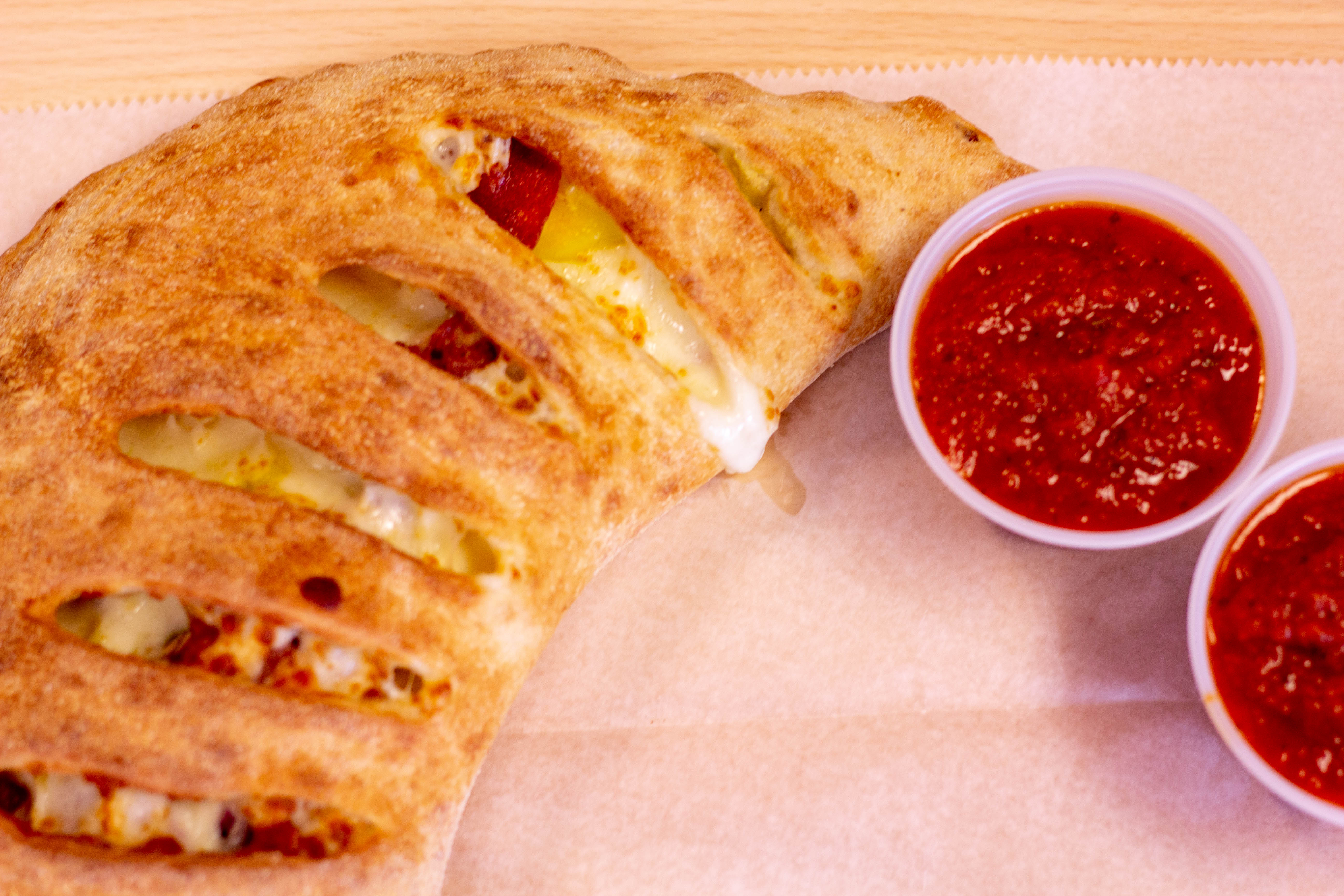 Order All Meat Calzone food online from La Porchetta Kitchen store, Sterling on bringmethat.com