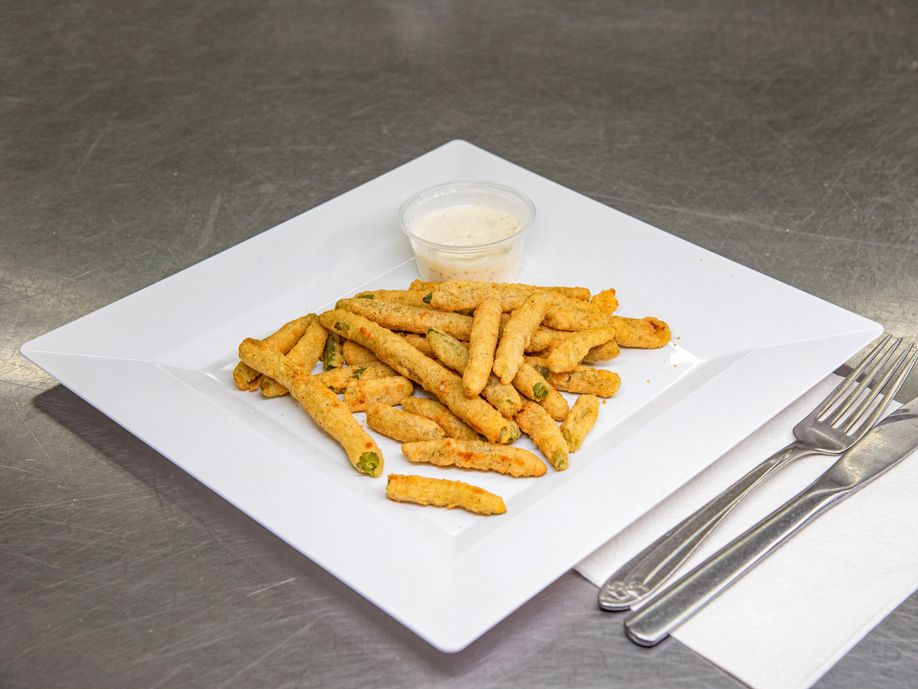 Order Toasted Onion Battered Green Beans food online from Around The World Gourmet store, Bellaire on bringmethat.com