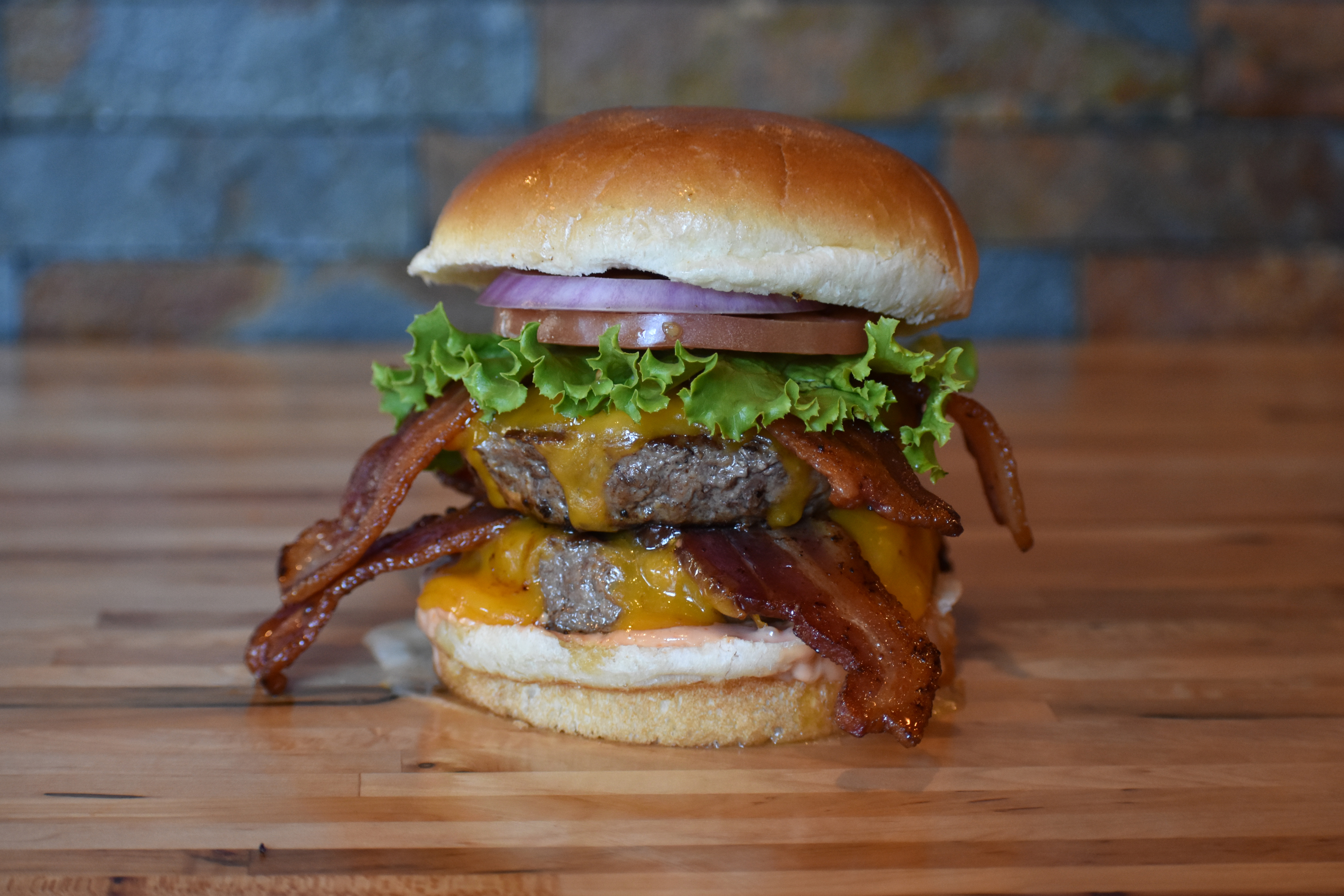 Order Double Bacon Cheeseburger food online from Burger District store, Arlington on bringmethat.com