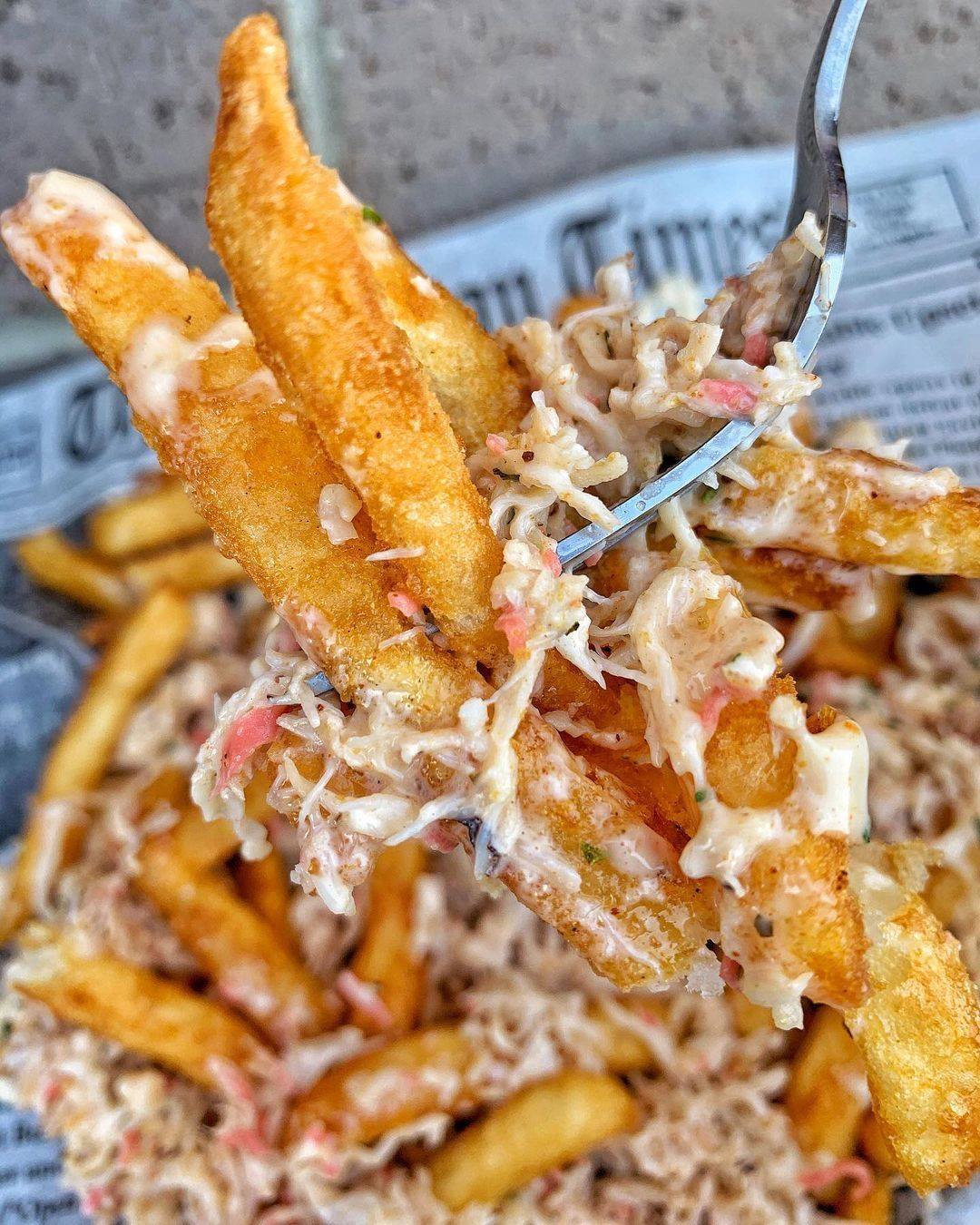 Order Crabmeat Fries food online from Hook & Reel Cajun Seafood store, West Valley City on bringmethat.com