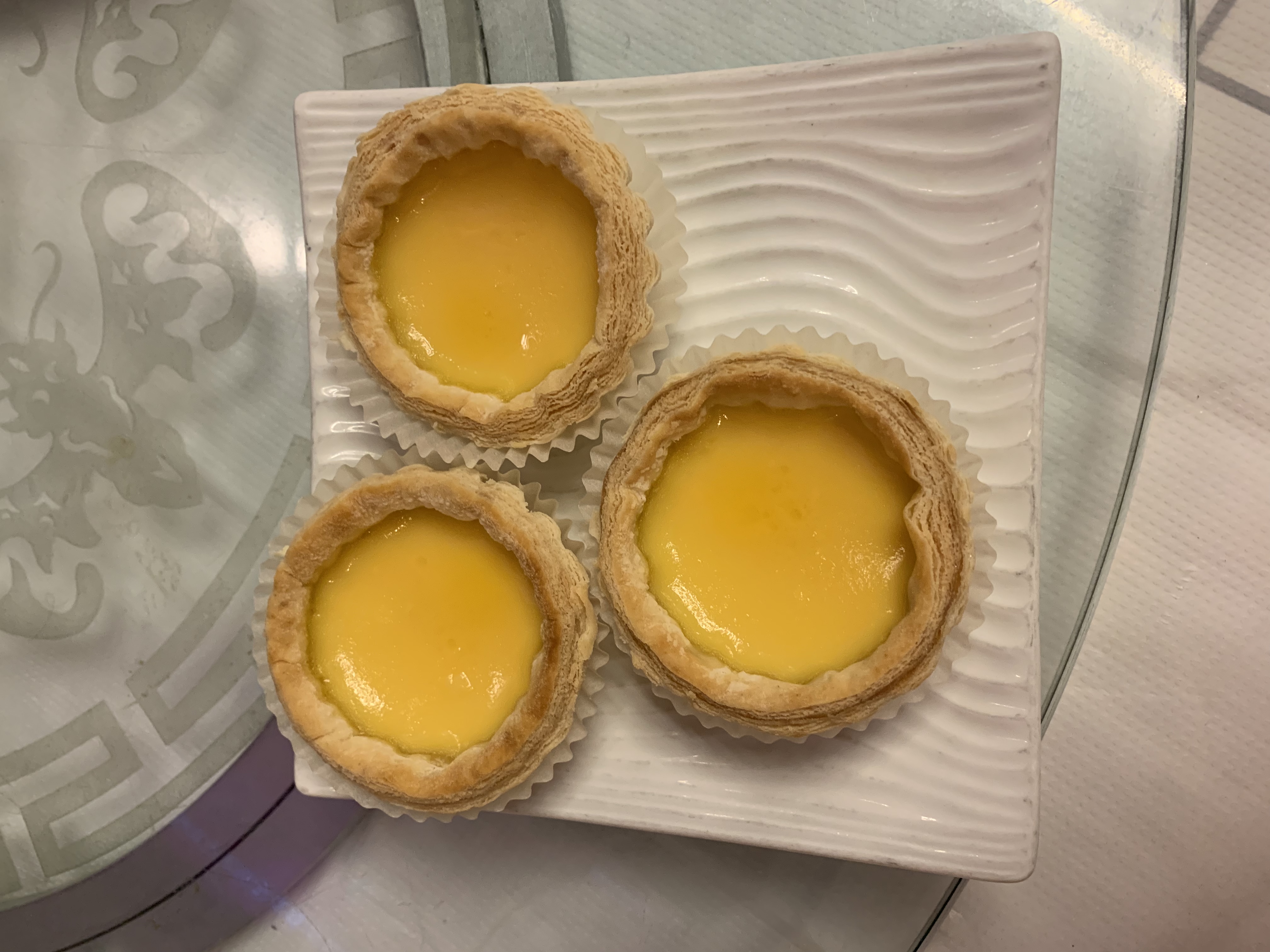 Order 50. Medium Egg Tart food online from China Cafe store, Chicago on bringmethat.com
