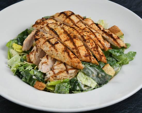 Order Big Islander Caesar Salad with Chicken food online from Rainforest Cafe store, Nashville on bringmethat.com