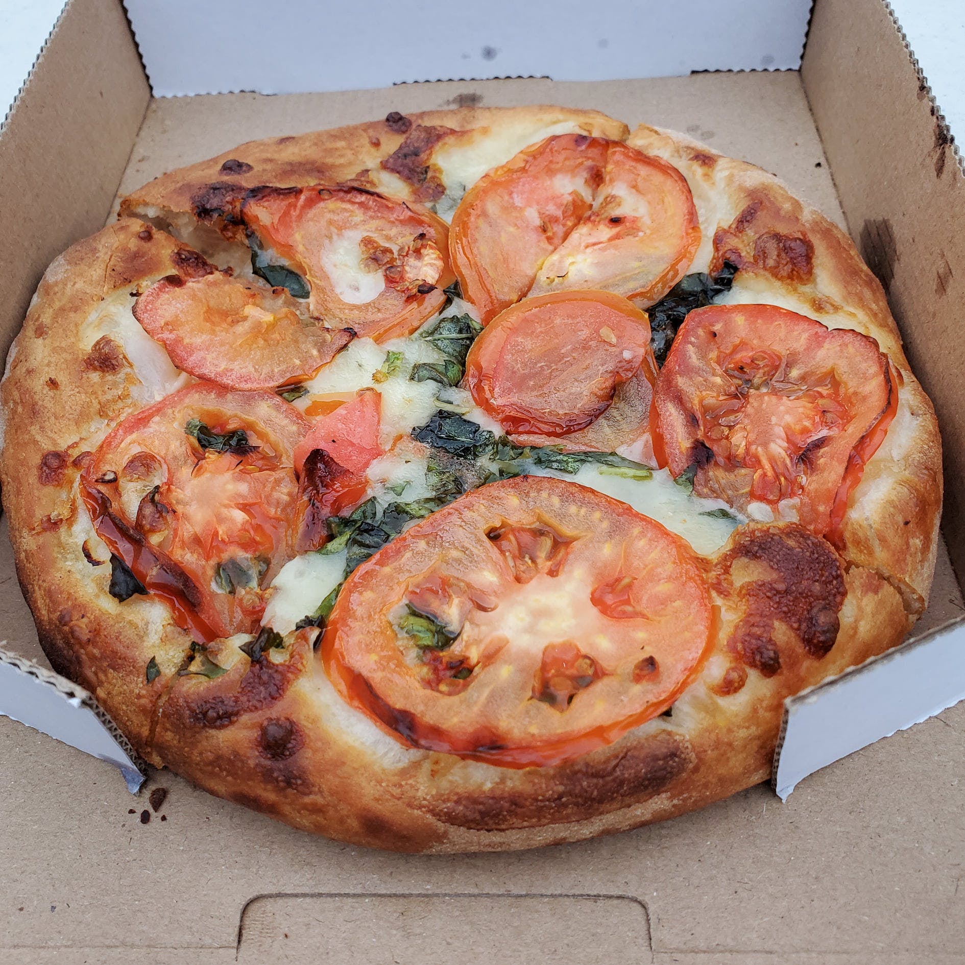 Order Fresh Tomato & Basil Pizza - Personal 7'' (4 Slices) food online from Crispy Crust store, Los Angeles on bringmethat.com