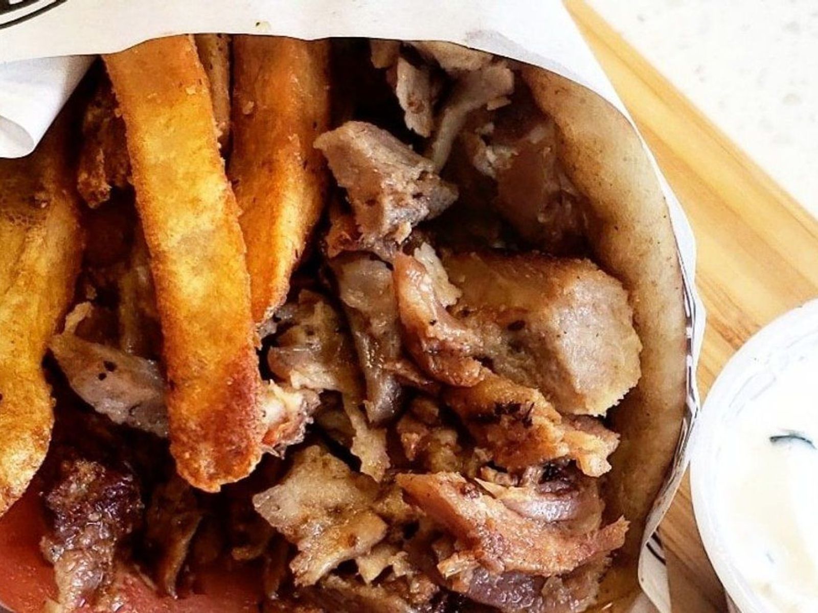 Order Hand Stacked Pork Gyro food online from Meat The Greek store, Eastchester on bringmethat.com