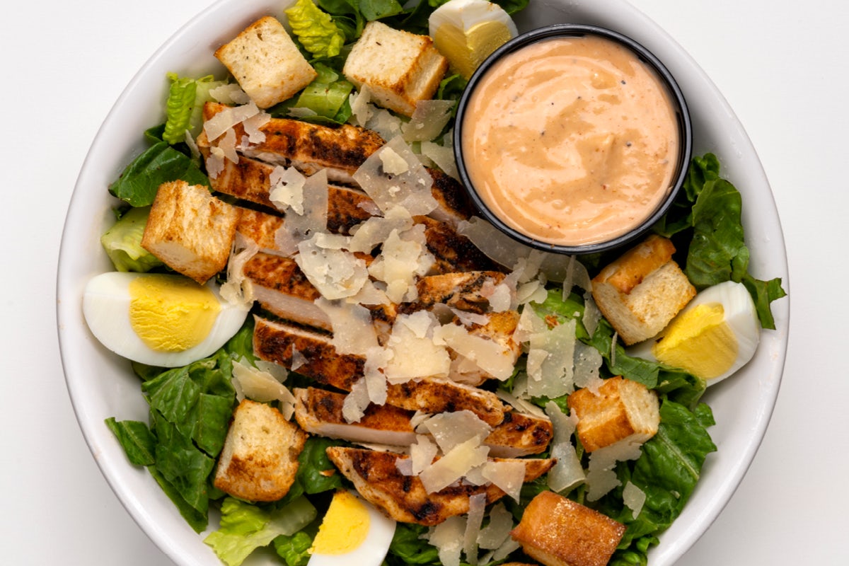 Order Sriracha Chicken Caesar Salad food online from Arooga's Grille House and Sports Bar store, Warwick on bringmethat.com