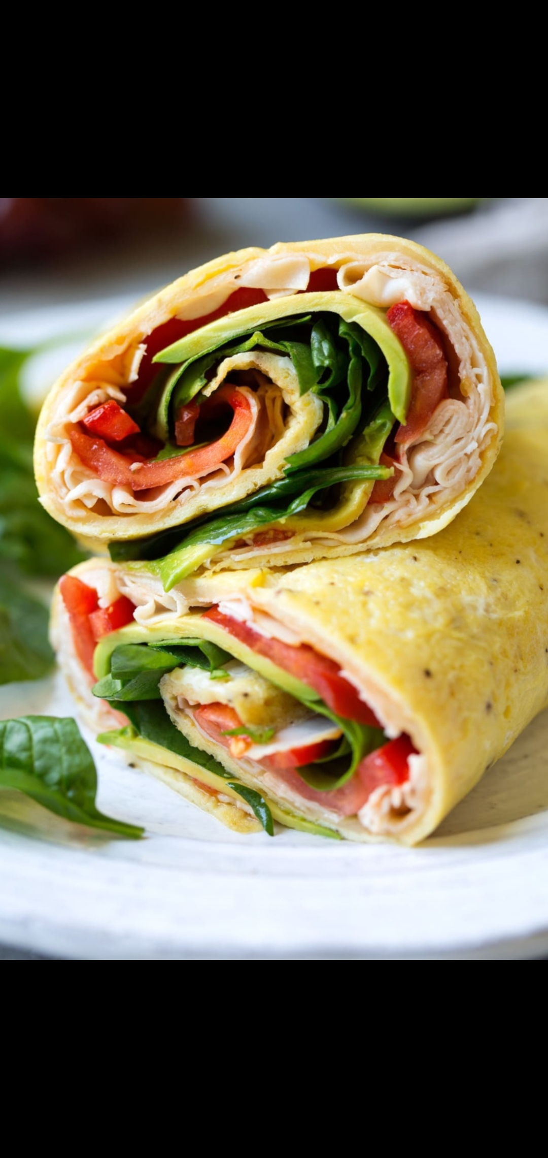 Order Four Egg Whites Salsalito Turkey Tomatoes Spinach & Avocado Wrap  food online from American Gourmet Foods Deli store, New York on bringmethat.com