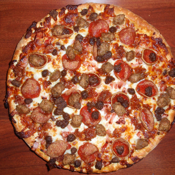 Order Meat Eater Pizza food online from Pizza Paradise store, Austin on bringmethat.com