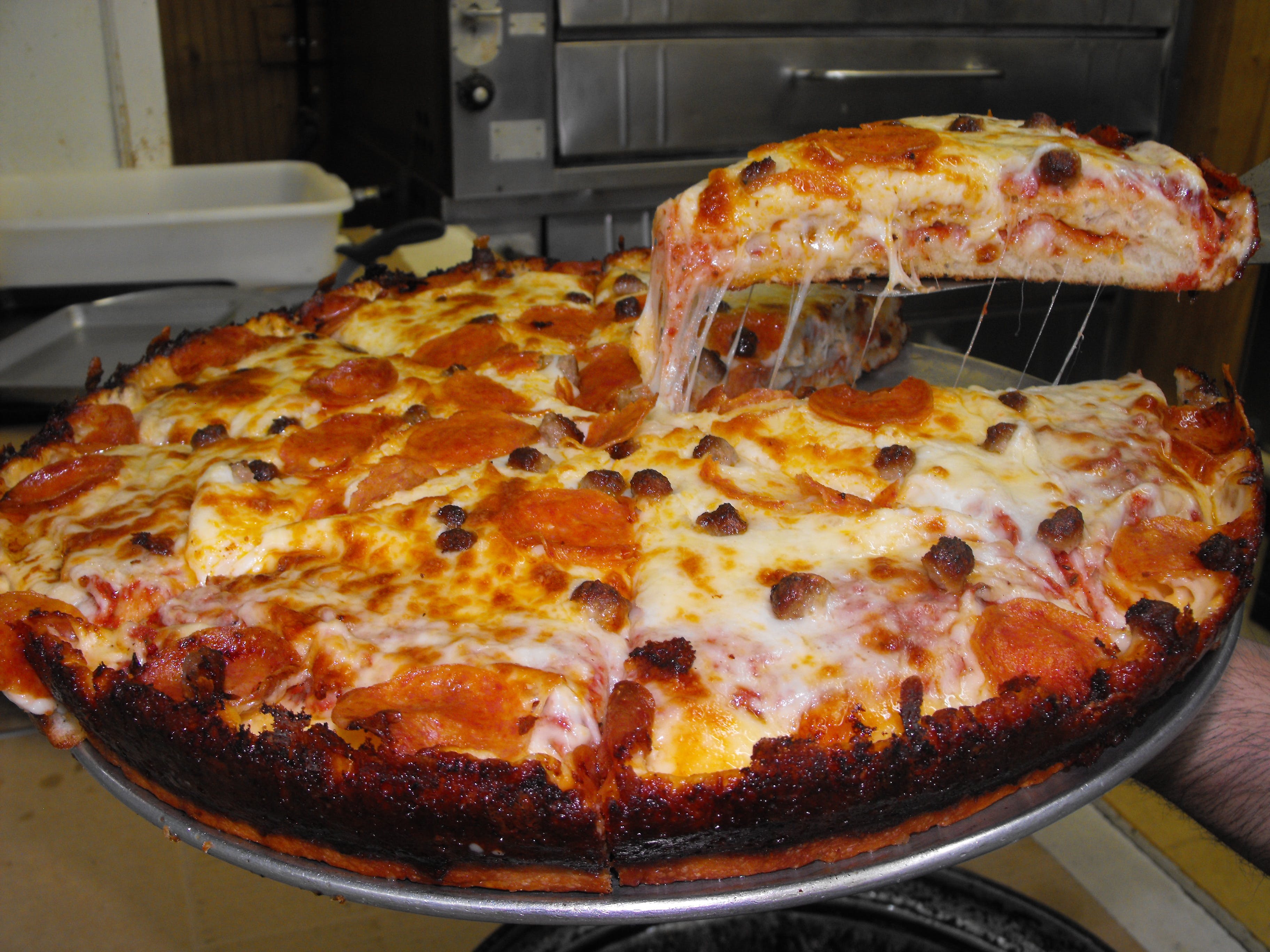 Order Deep Dish Pizza - Large 14" (8 Slices) food online from Mr C Deli & Pizza store, Clinton Twp on bringmethat.com