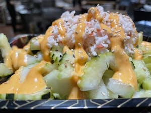 Order Cucumber Salad food online from Aki Sushi & Japanese Fusion store, San Jacinto on bringmethat.com