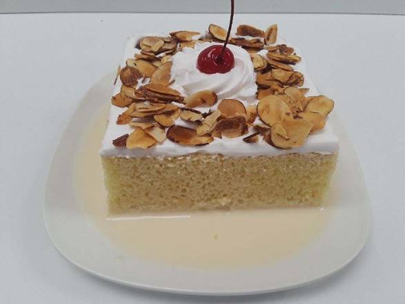 Order Tres Leches Cake Slice food online from El Super store, Corona on bringmethat.com