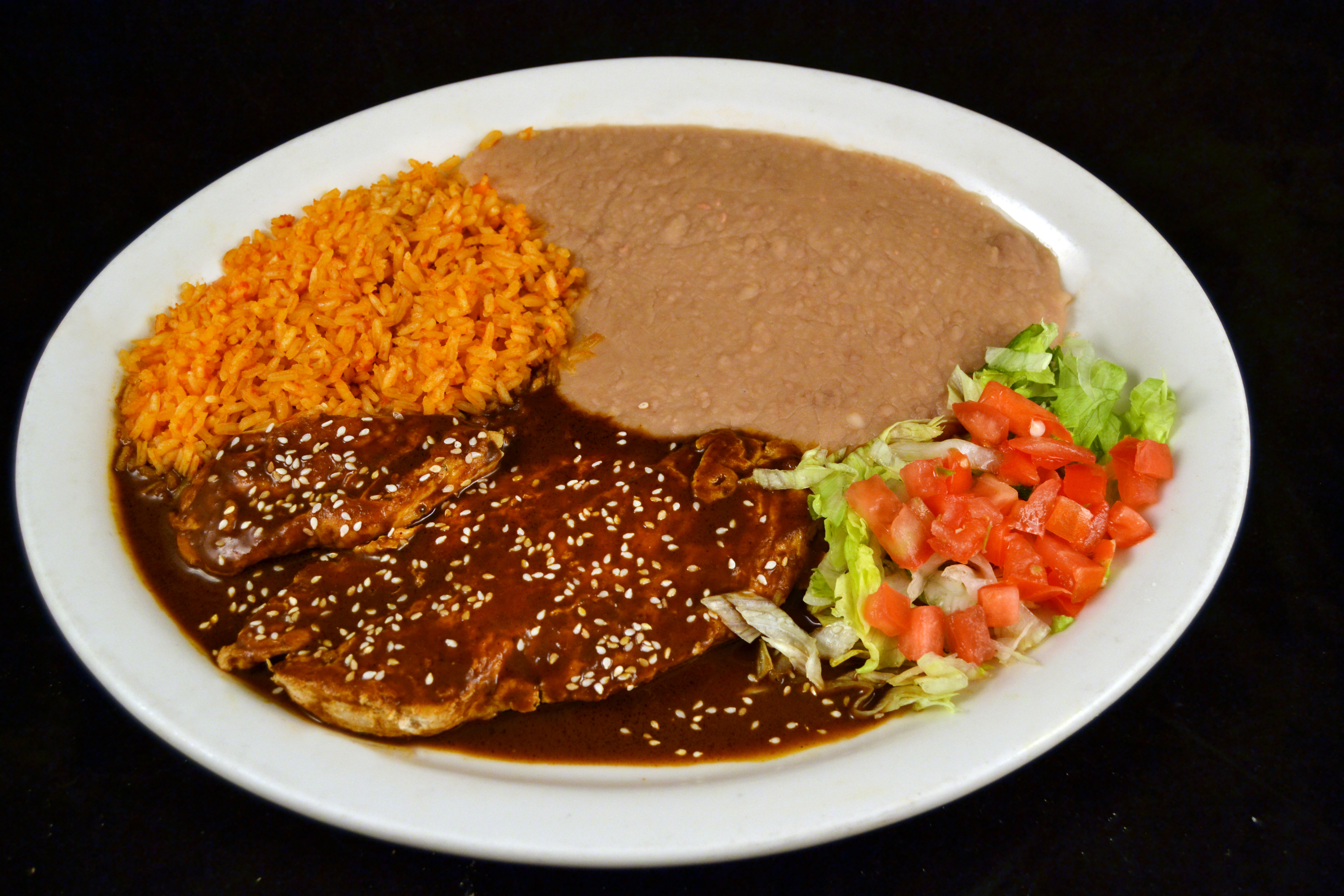 Order Pechuga con Mole food online from Mi Comal Mexican Restaurant store, Irving on bringmethat.com