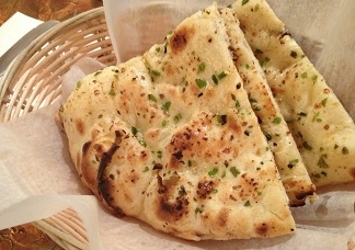Order Garlic Naan food online from Hyderabad House Biryani Place store, Omaha on bringmethat.com
