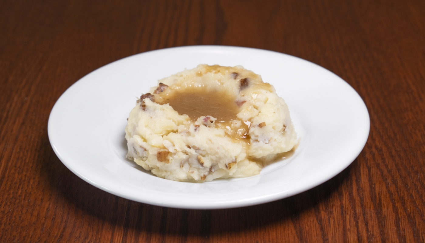 Order Mashed Potatoes & Brown Gravy food online from Smokey Bones Barbeque & Grill store, Grove City on bringmethat.com