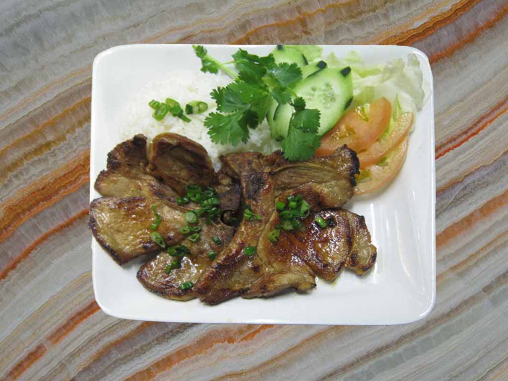 Order 812. Grilled Pork Chop over Rice Plate food online from San Sun store, San Francisco on bringmethat.com
