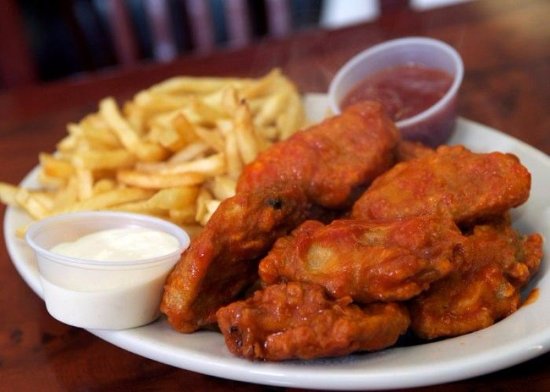 Order spicy wings with fries  food online from La estrella del castillo store, Brooklyn on bringmethat.com