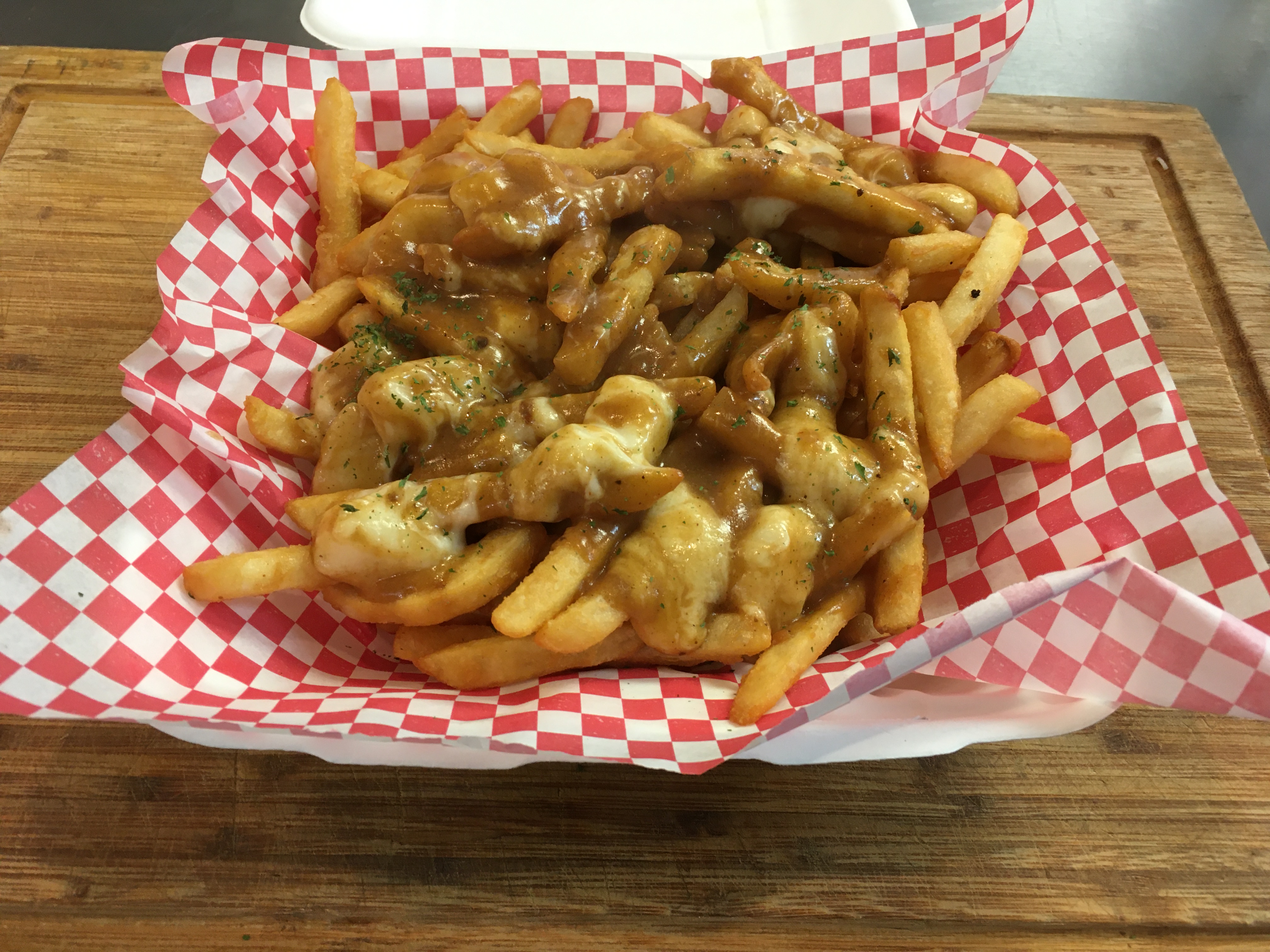 Order Poutine food online from Celebrations Comfort Kitchen store, Manchester on bringmethat.com