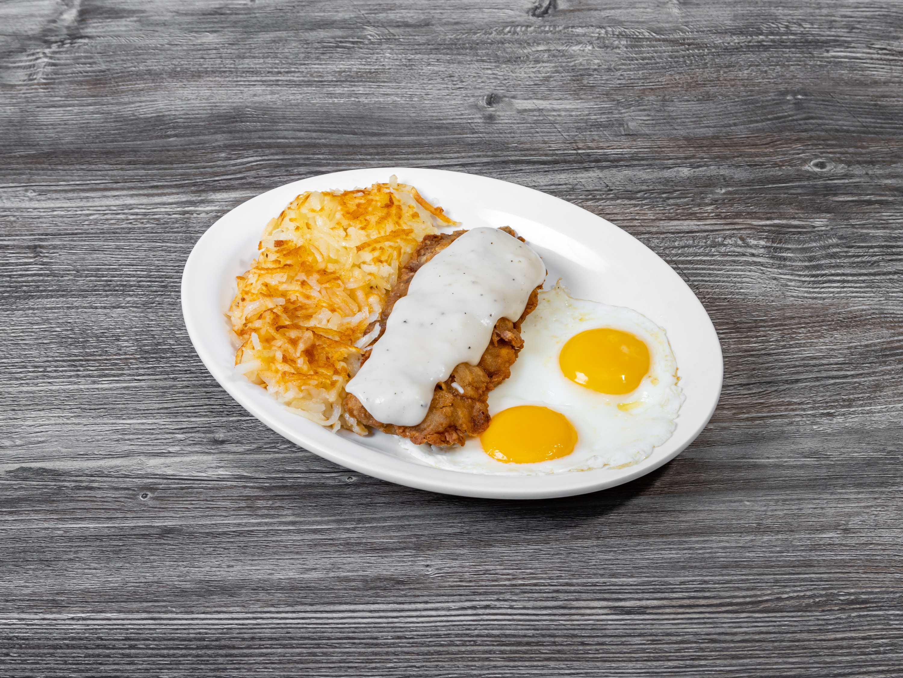 Order Chicken Fried Steak with Eggs food online from Eggspress Cafe store, Lewisville on bringmethat.com