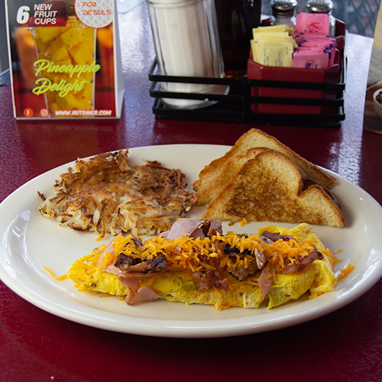 Order Porky Omelette food online from The Hut Diner store, San Antonio on bringmethat.com