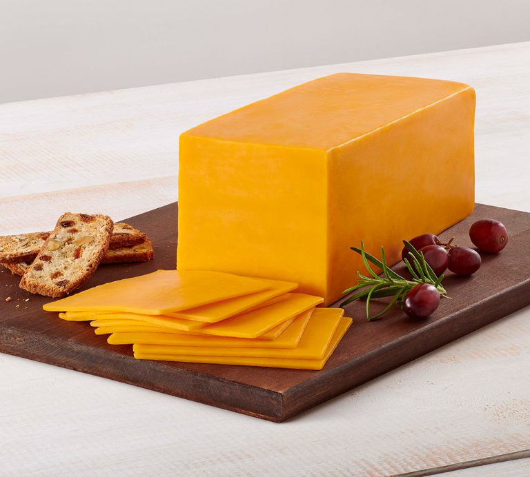 Order Sharp Cheddar Cheese 1/2 lb.  food online from Trunnell Gourmet Deli On 54 store, Owensboro on bringmethat.com
