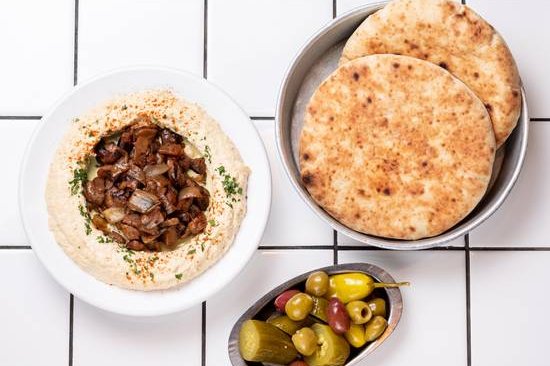 Order Hummus, Mushrooms and Onions food online from 12 chairs store, New York on bringmethat.com